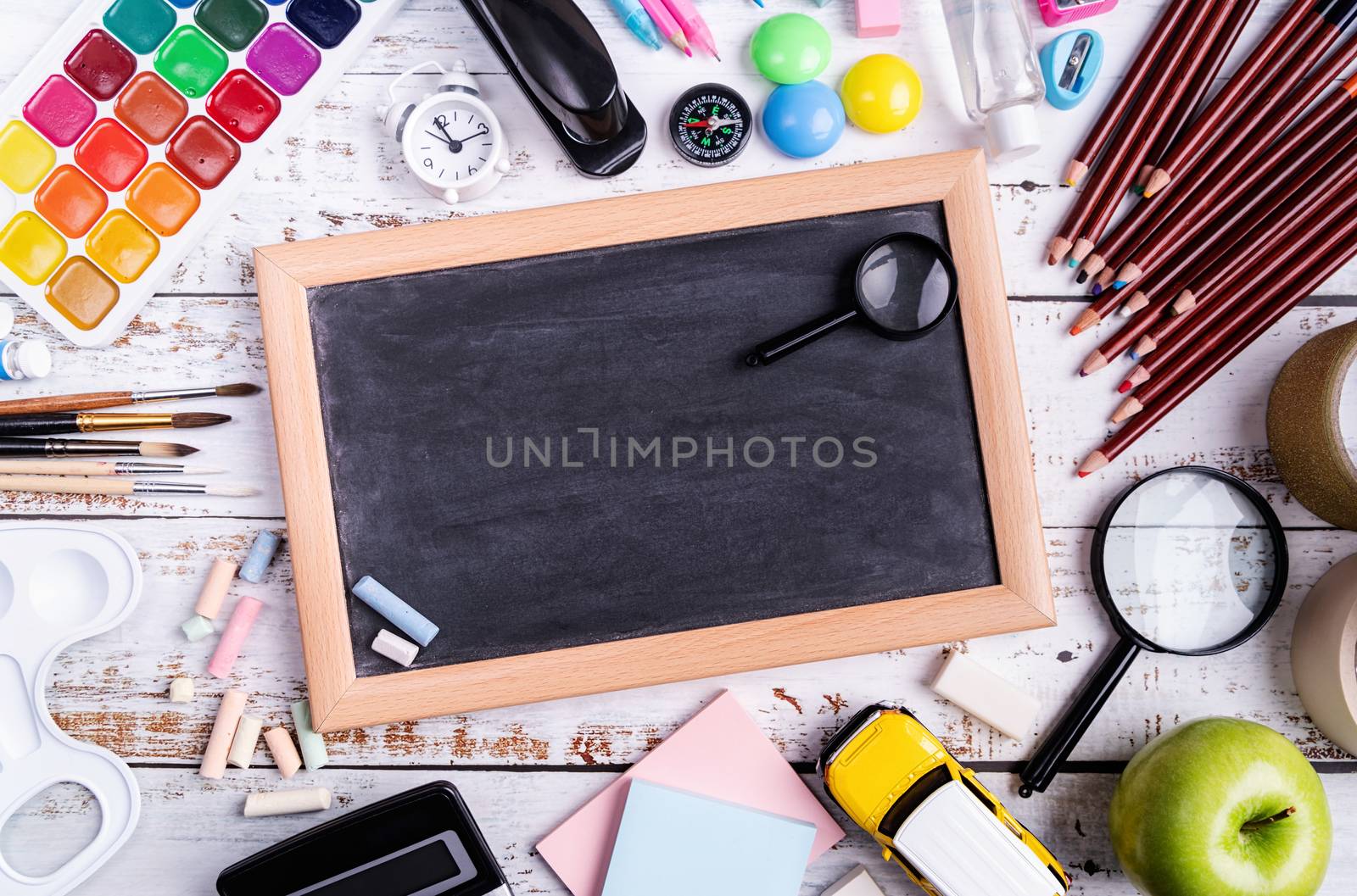 Back to school concept. School and office supplies on wooden table. Flat lay with copy space.