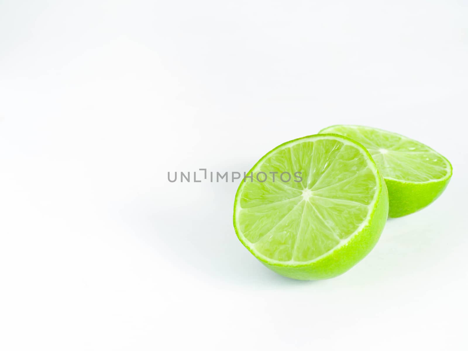 Lime Is a blackberry,The fruit is very sour,Half turned Lime,White background