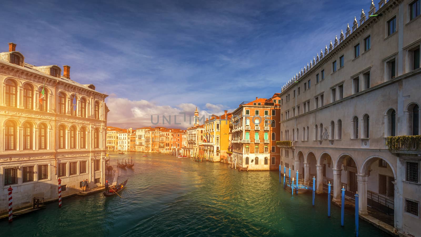 Grand Canal with gondolas in Venice, Italy. Sunset view of Venice Grand Canal. Architecture and landmarks of Venice. Venice postcard