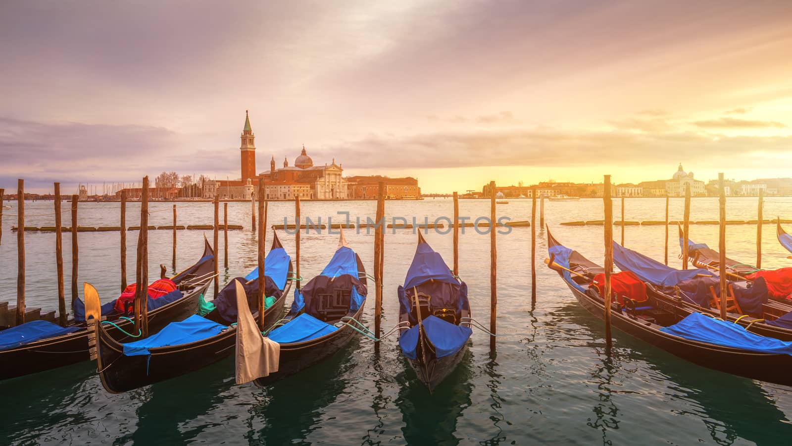 Sunrise in San Marco square, Venice, Italy. Venice Grand Canal. Architecture and landmarks of Venice. Venice postcard with Venice gondolas
