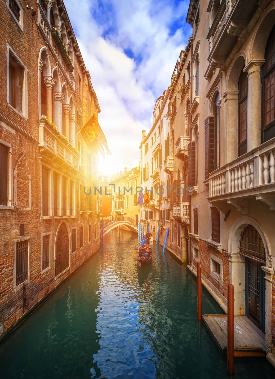Canal with gondolas in Venice, Italy. Architecture and landmarks of Venice. Venice postcard with Venice gondolas.