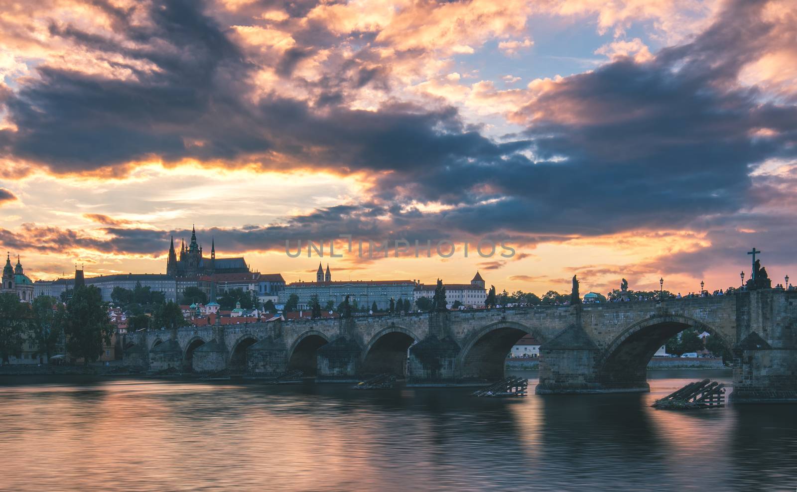 View of Prague Castle and Charles Bridge at sunset. Czechia