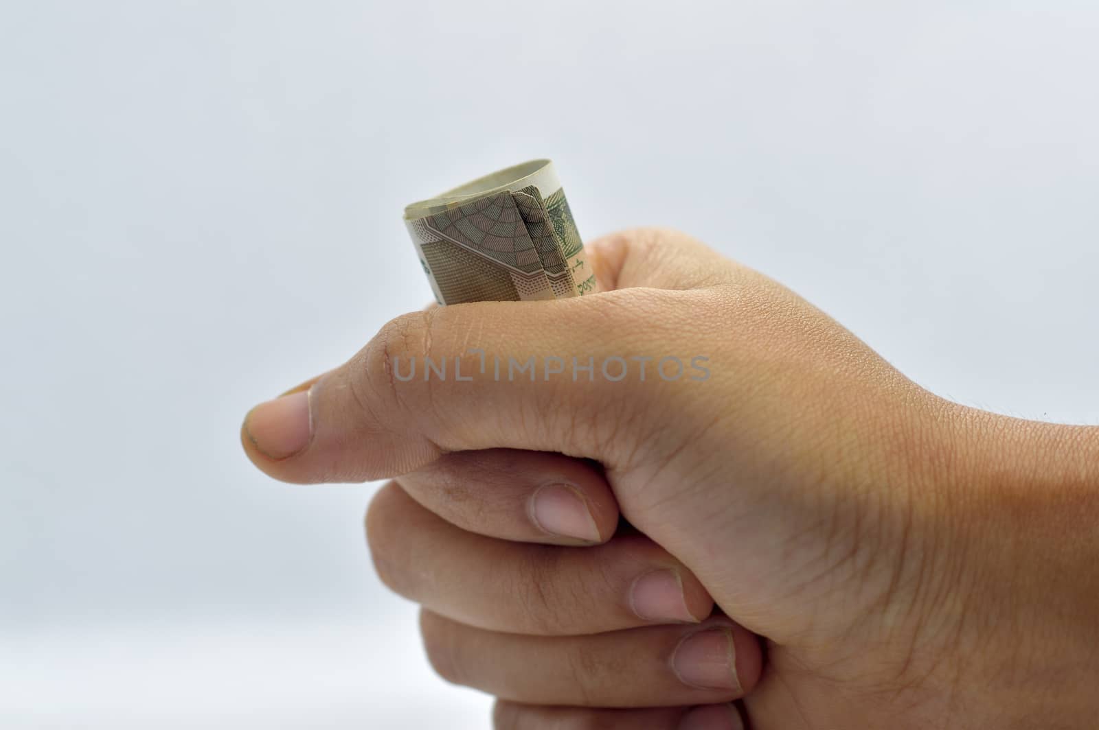 Man hand holding or grabbing money, indian rupees.