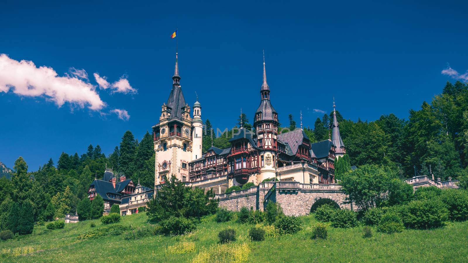 Peles Castle, Romania. Beautiful famous royal castle and ornamental garden in Sinaia landmark of Carpathian Mountains in Europe