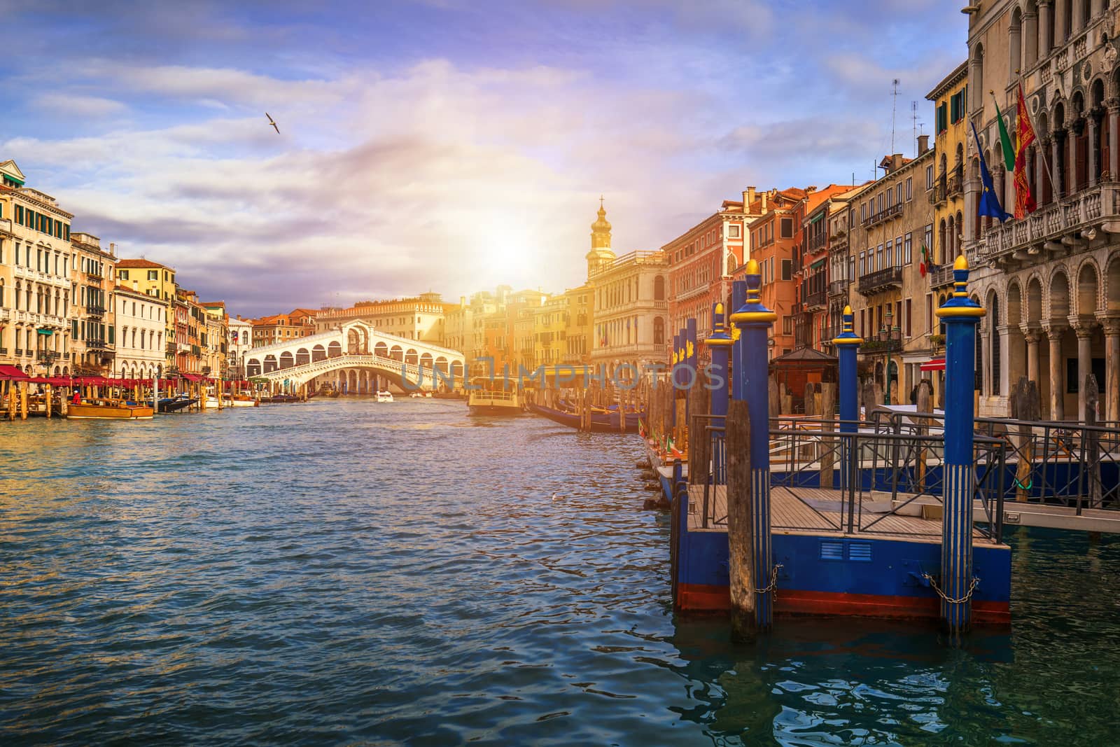 Grand Canal with gondolas in Venice, Italy. Sunset view of Venice Grand Canal. Architecture and landmarks of Venice. Venice postcard