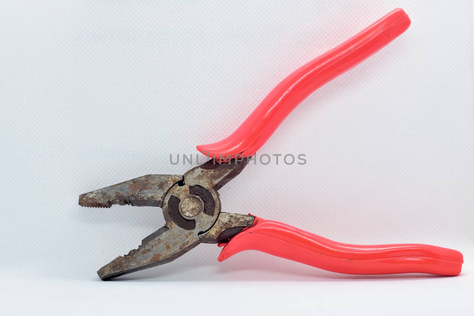 Old used iron cutting pliers tongs isolated on white background by rkbalaji
