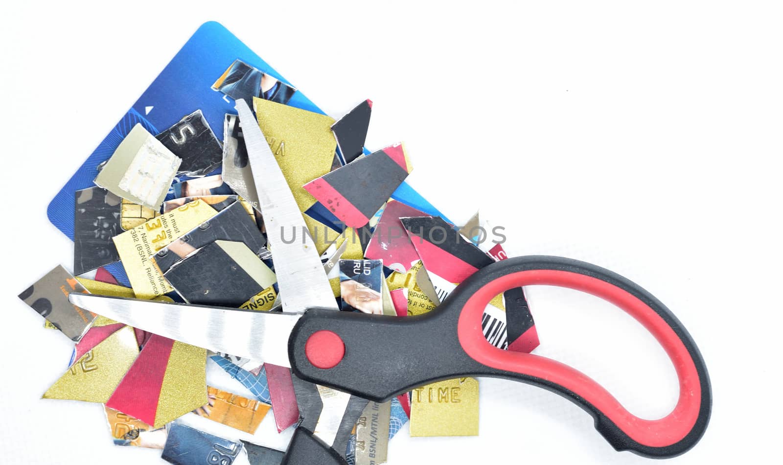 Cut card as pieces with scissors for stop to pay money protect crisis cost