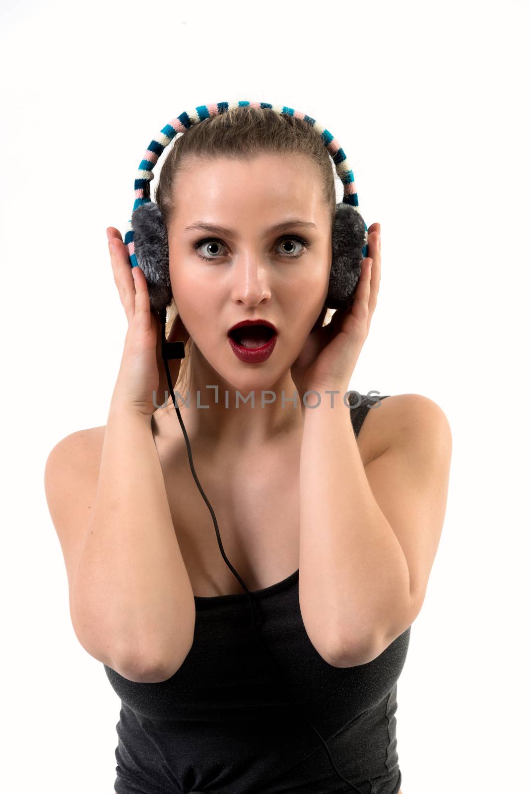 Surprised Woman Listening on Headphones - mouth open