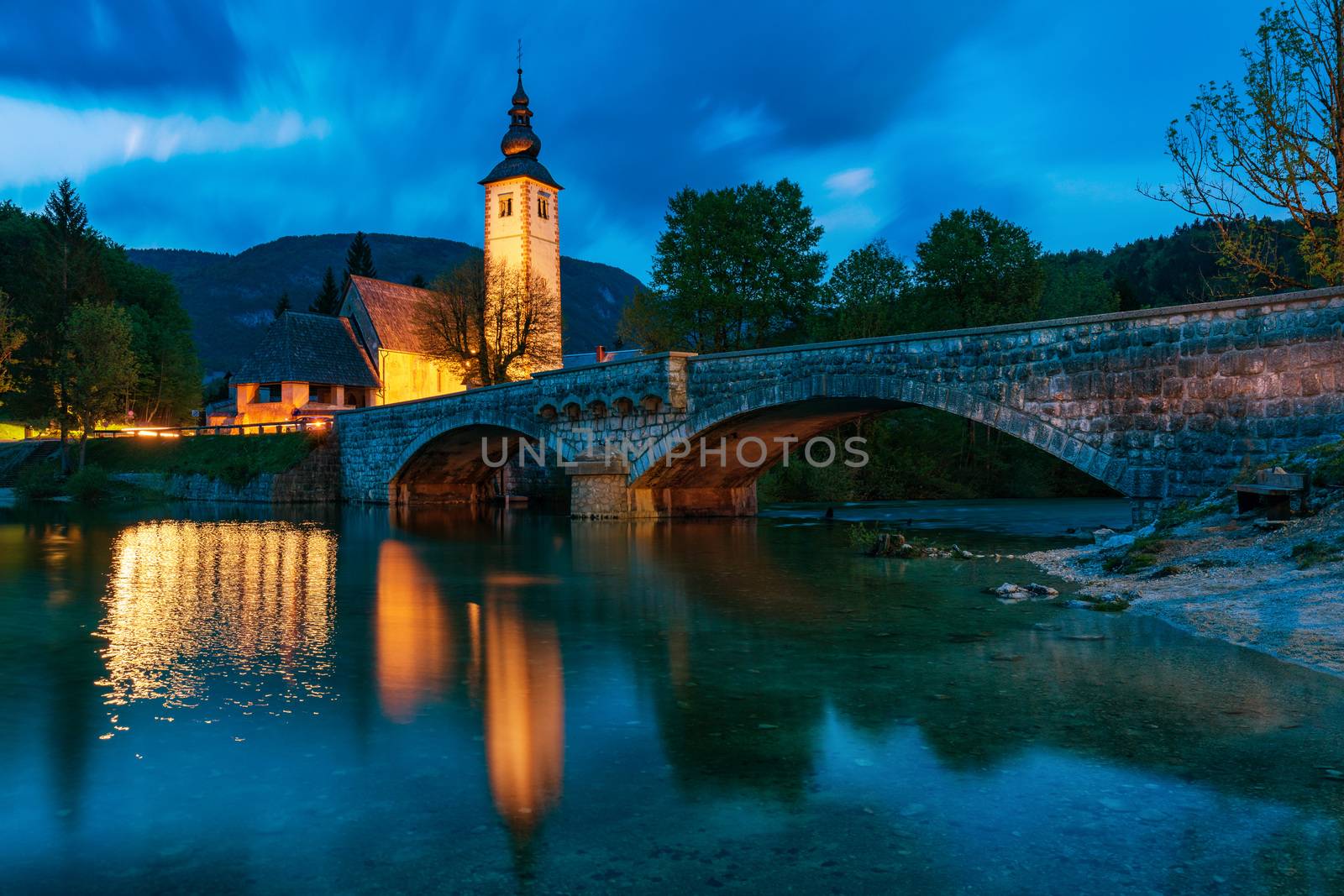 Church of Sv. John the Baptist and a bridge by the Bohinj lake in night, Slovenia. Church of St John the Baptist with bridge. Triglav National Park, Julian Alps, Slovenia, Europe