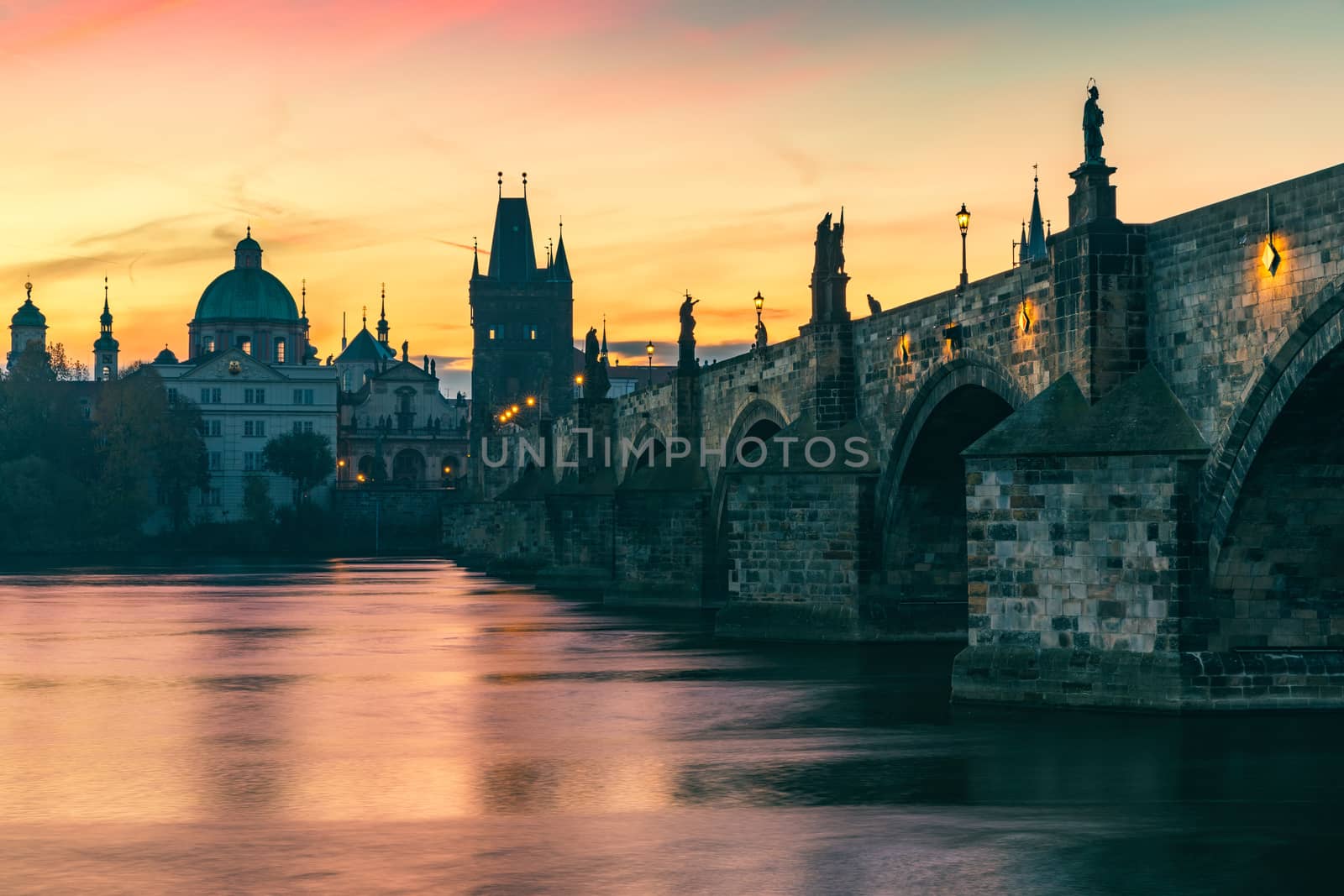 Scenic spring sunrise view of the Old Town pier architecture and Charles Bridge over Vltava river in Prague, Czech Republic