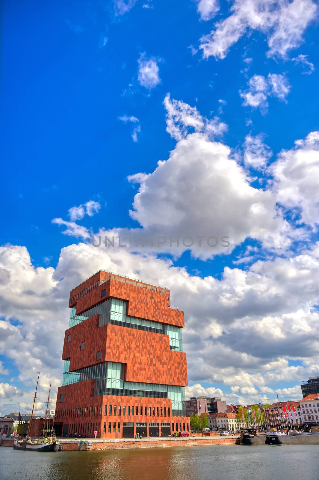 Antwerp, Belgium - April 26, 2019: Museum aan de Stroom (MAS) along the river Scheldt and the Port of Antwerp in Antwerp, Belgium.