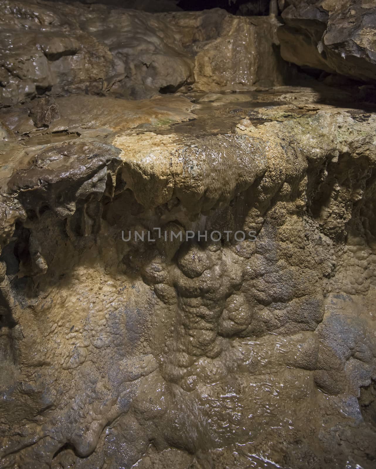 Closeup detail of geological rock formations in underground subterranean limestone cave cavern