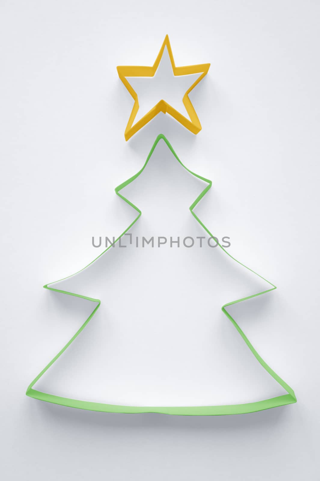 Christmas tree made of paper on white background