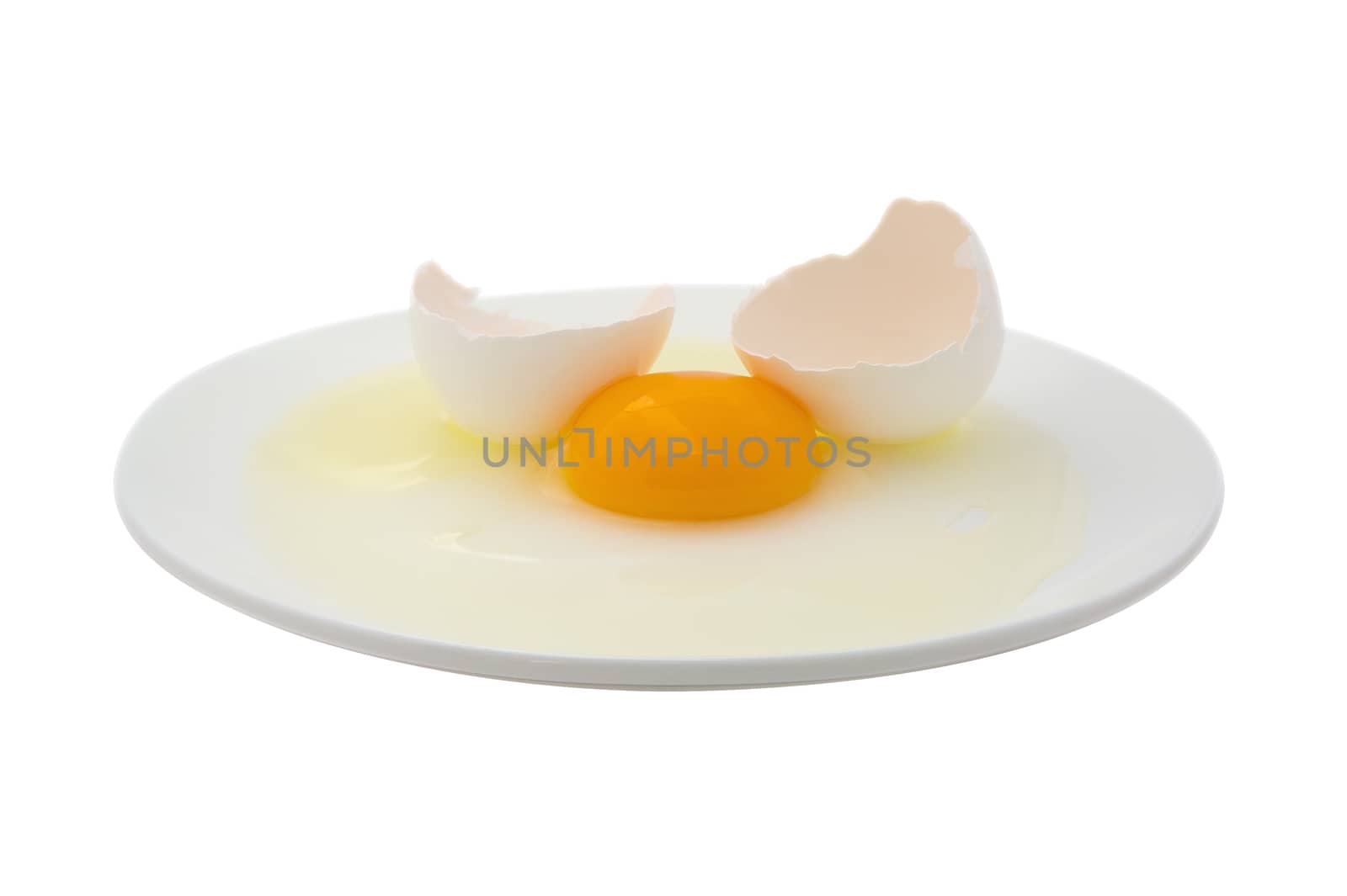 Broken egg on a dish isolated on a white. Clipping path included.