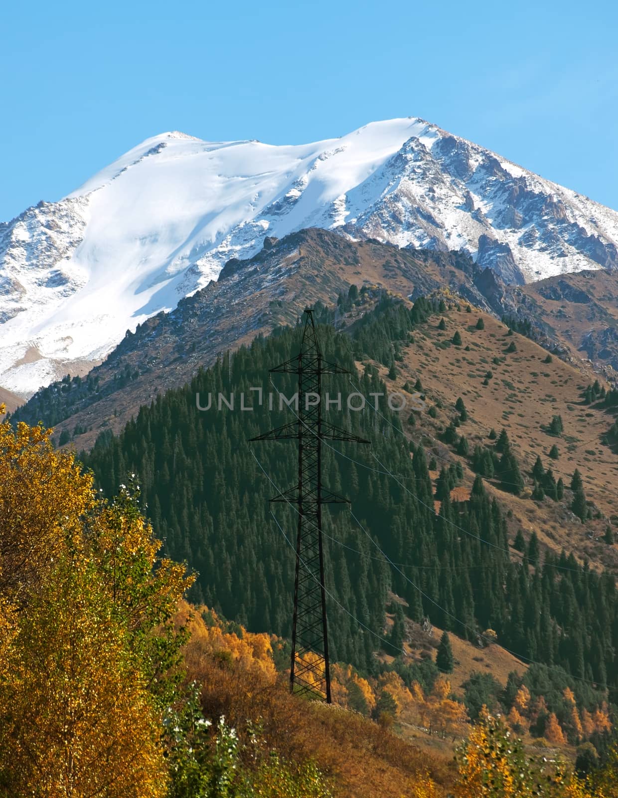 High-voltage power line through Alps mountains