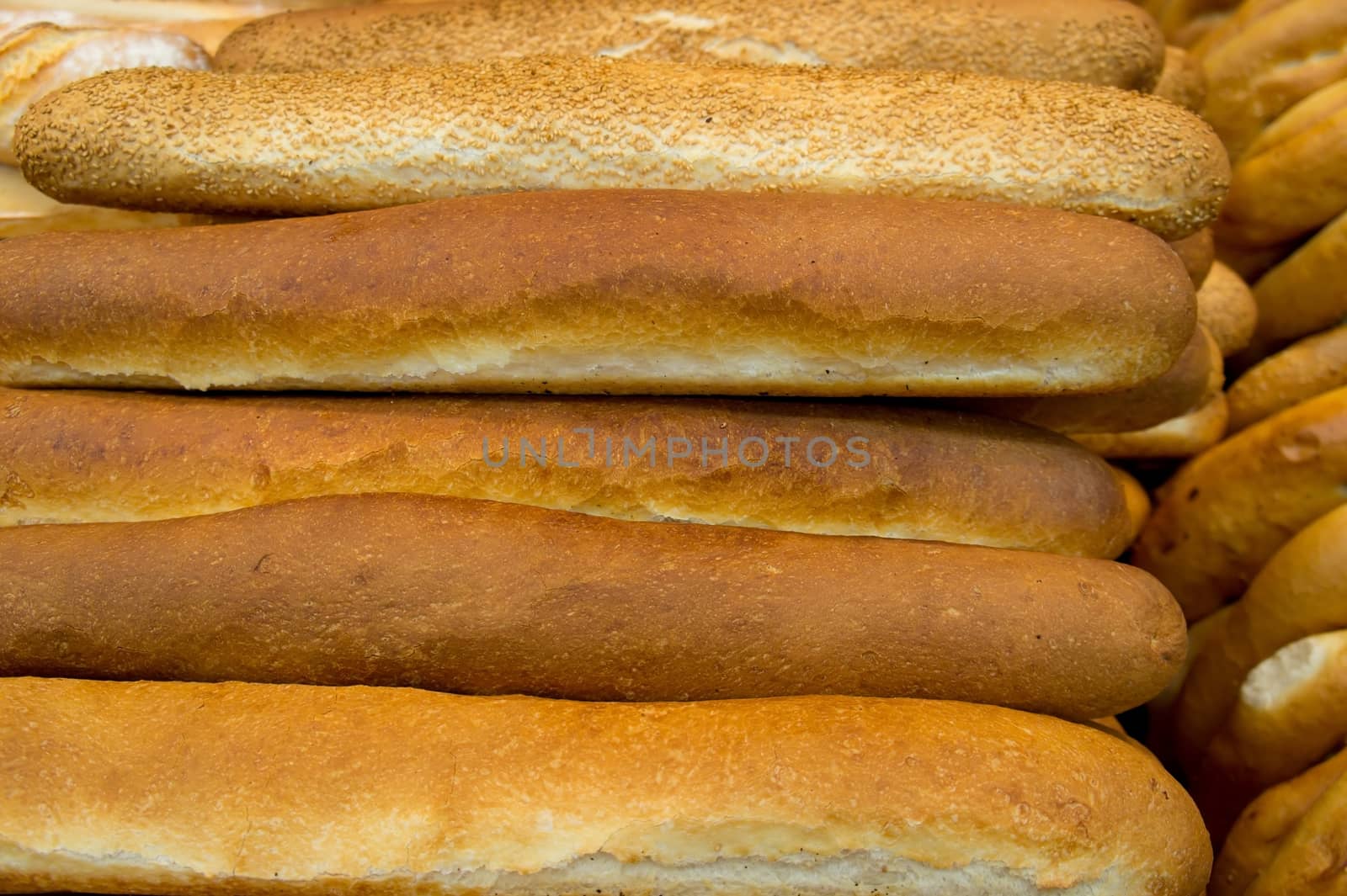 Lot of freshly baked french bread with crispy crust