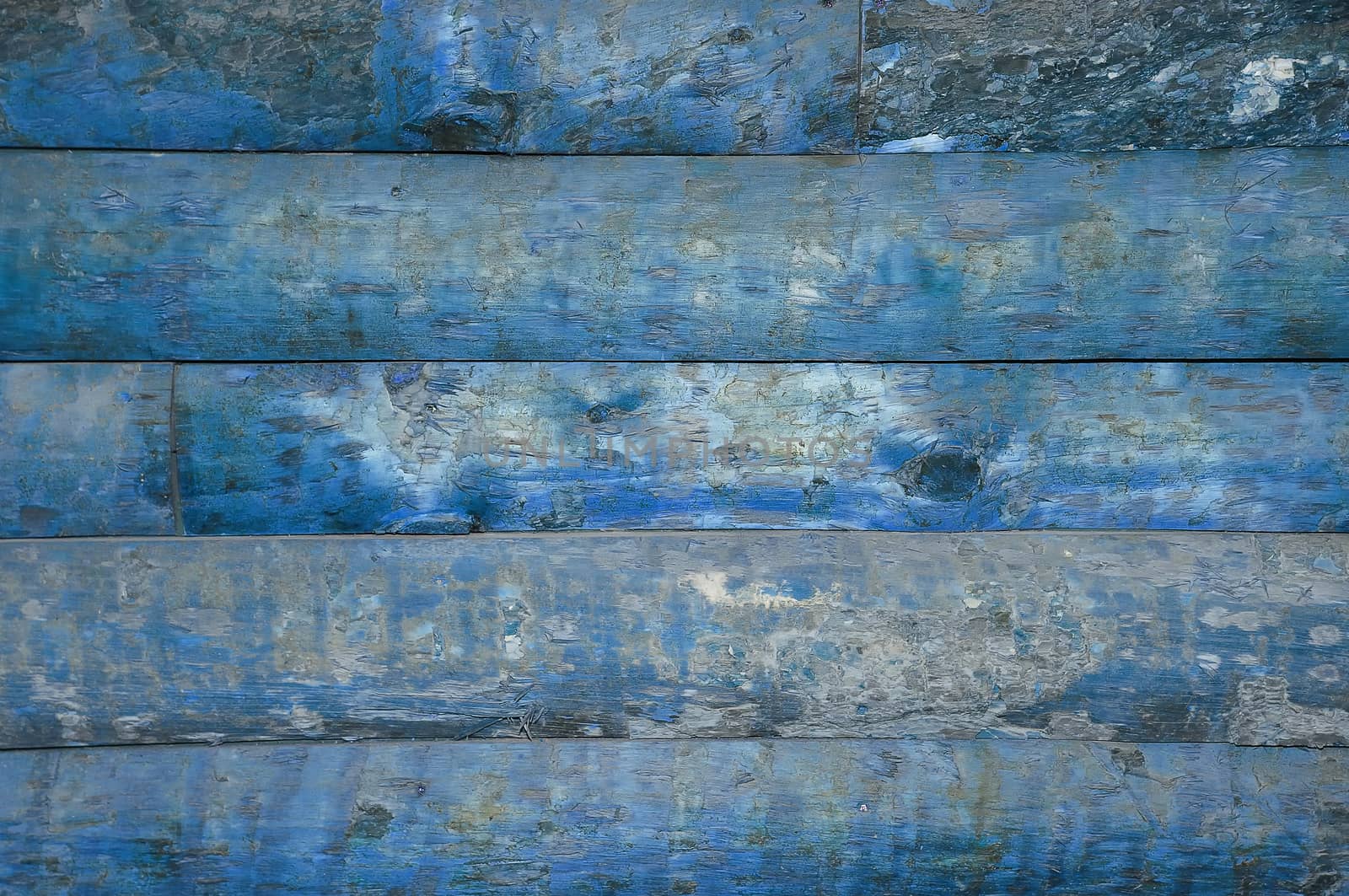 A background of old wood blue with knots.