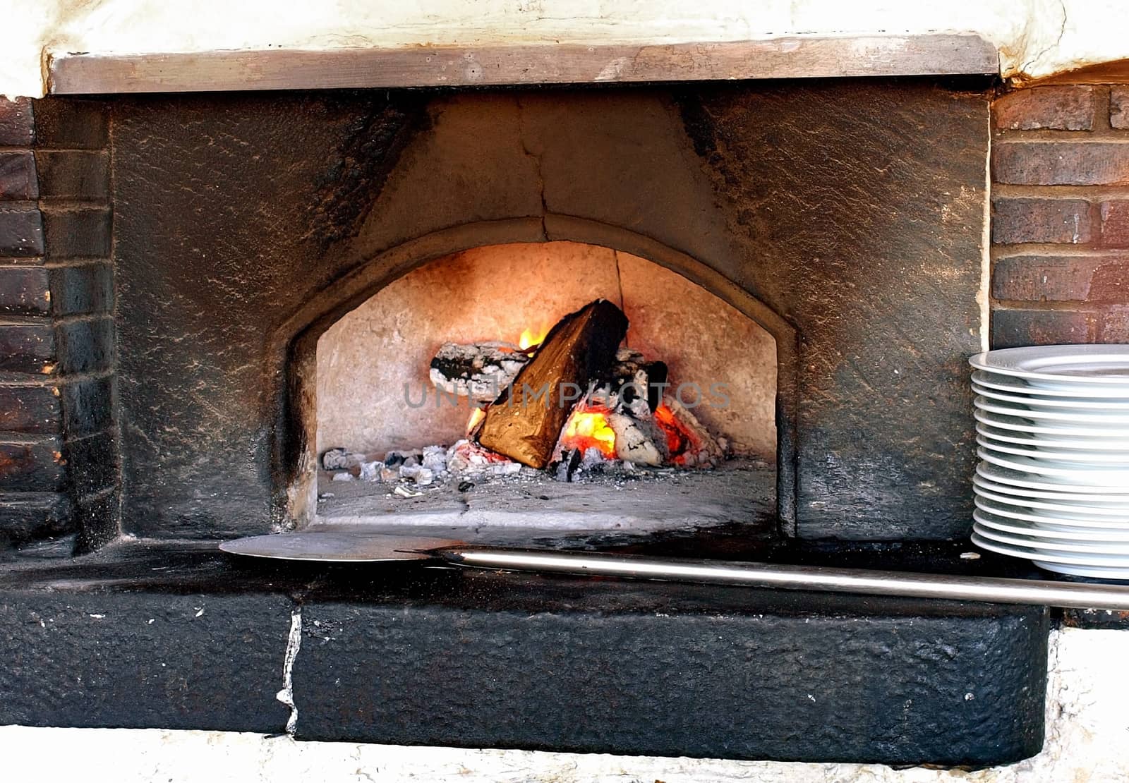 Old stove with burning firewoods.