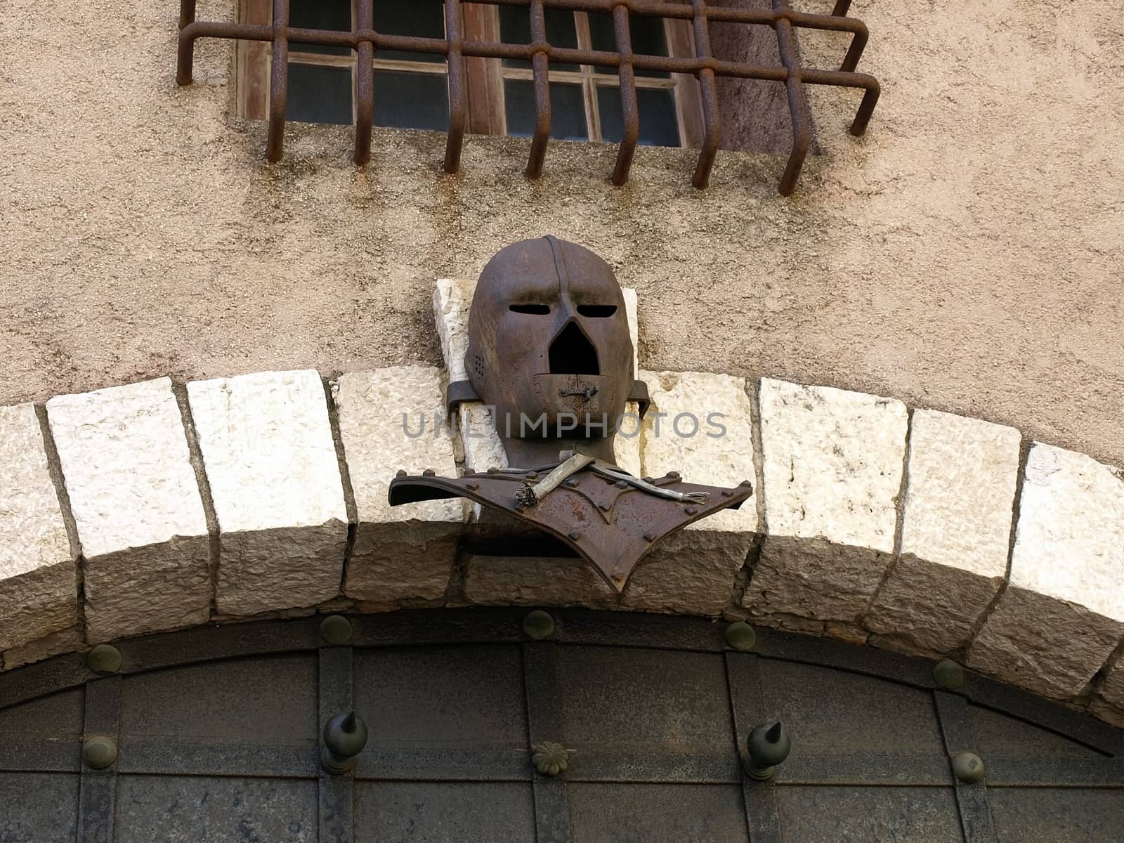 Ancient metal gate with helmet of medieval knight. La Tour Du Suquet in Cannes, France.