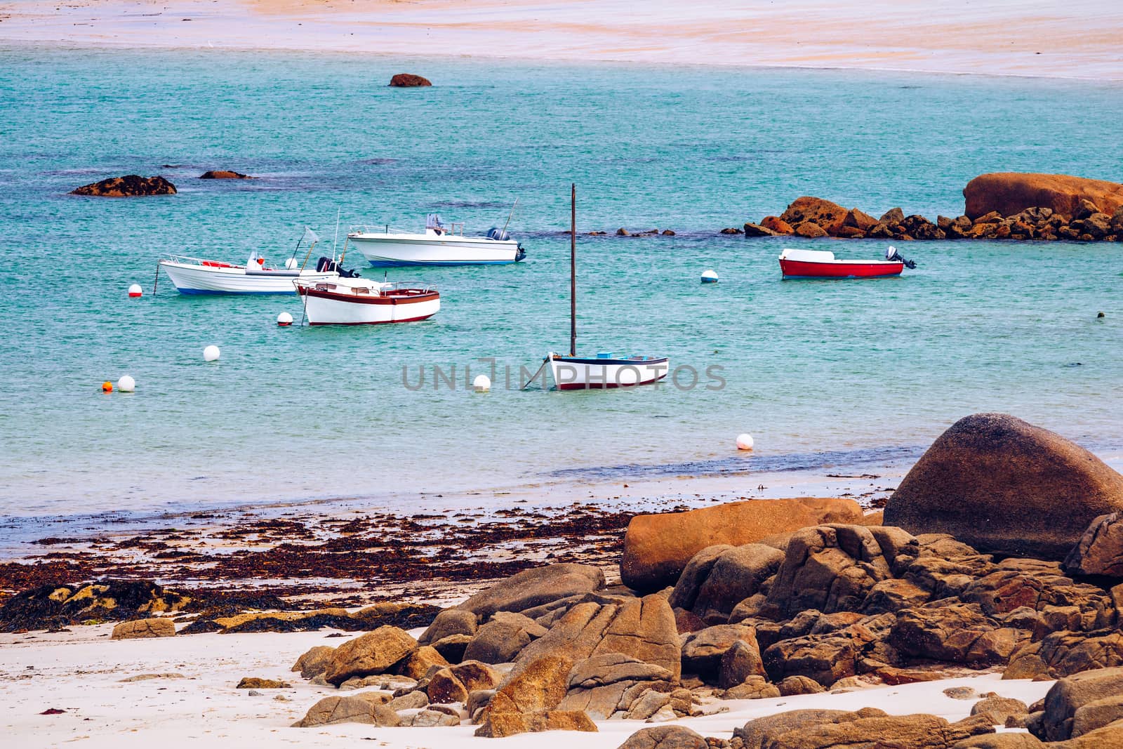 Boats in the port on the Pink Granite Coast (cote de granite rose in french). Brittany (Bretagne), France