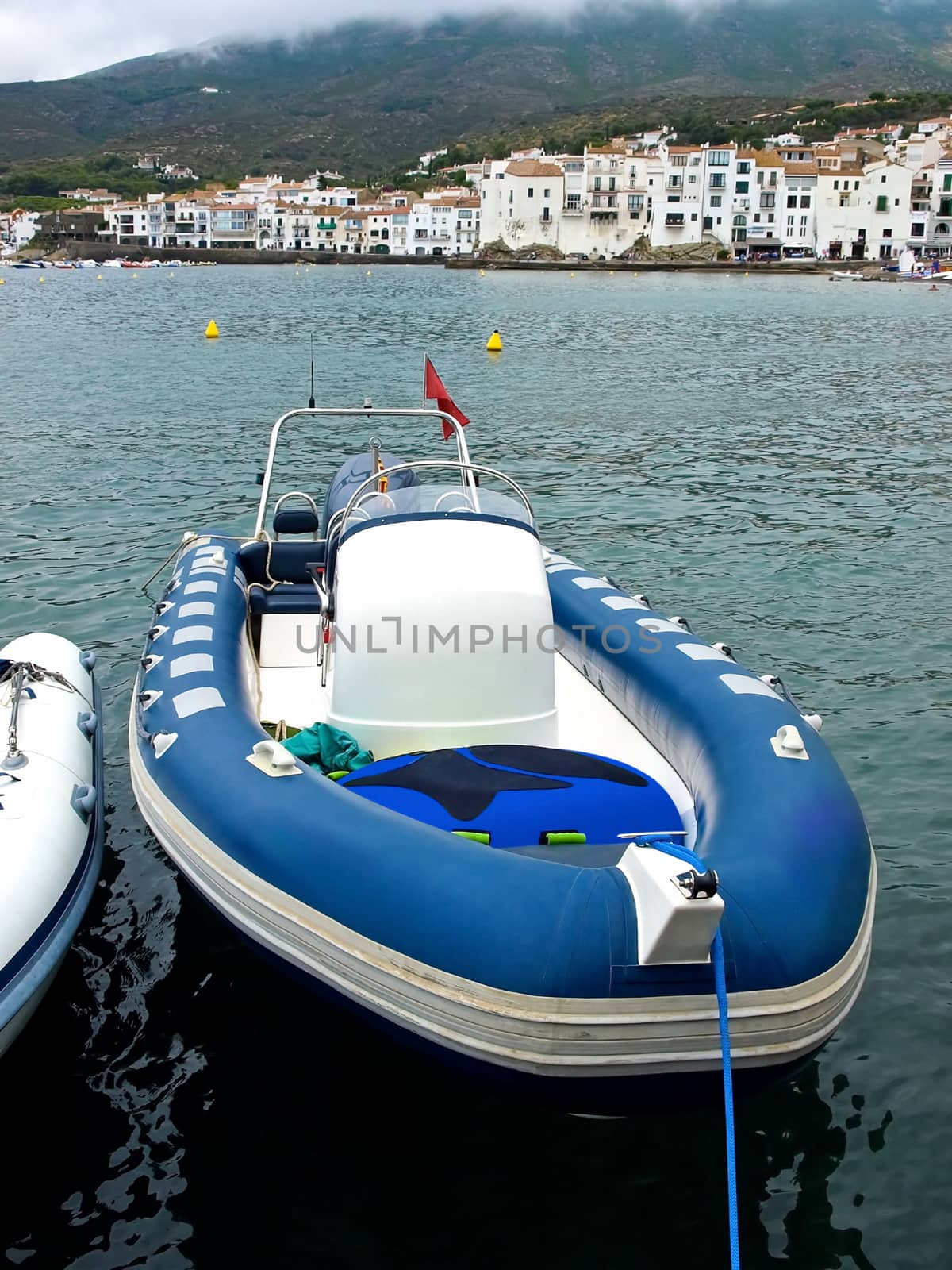 Blue motor inflatable boat in Cadaques, Costa Brava, Catalonia, Spain.