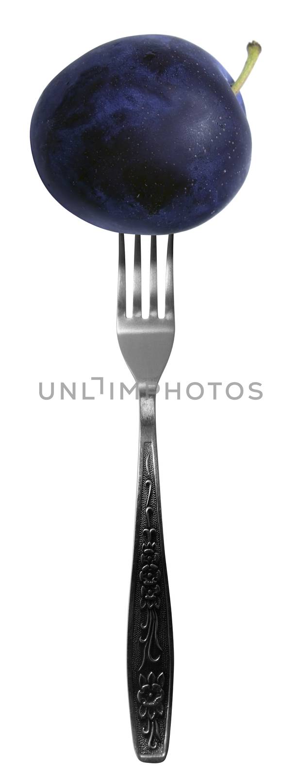 Juicy plum on fork isolated on a white background.