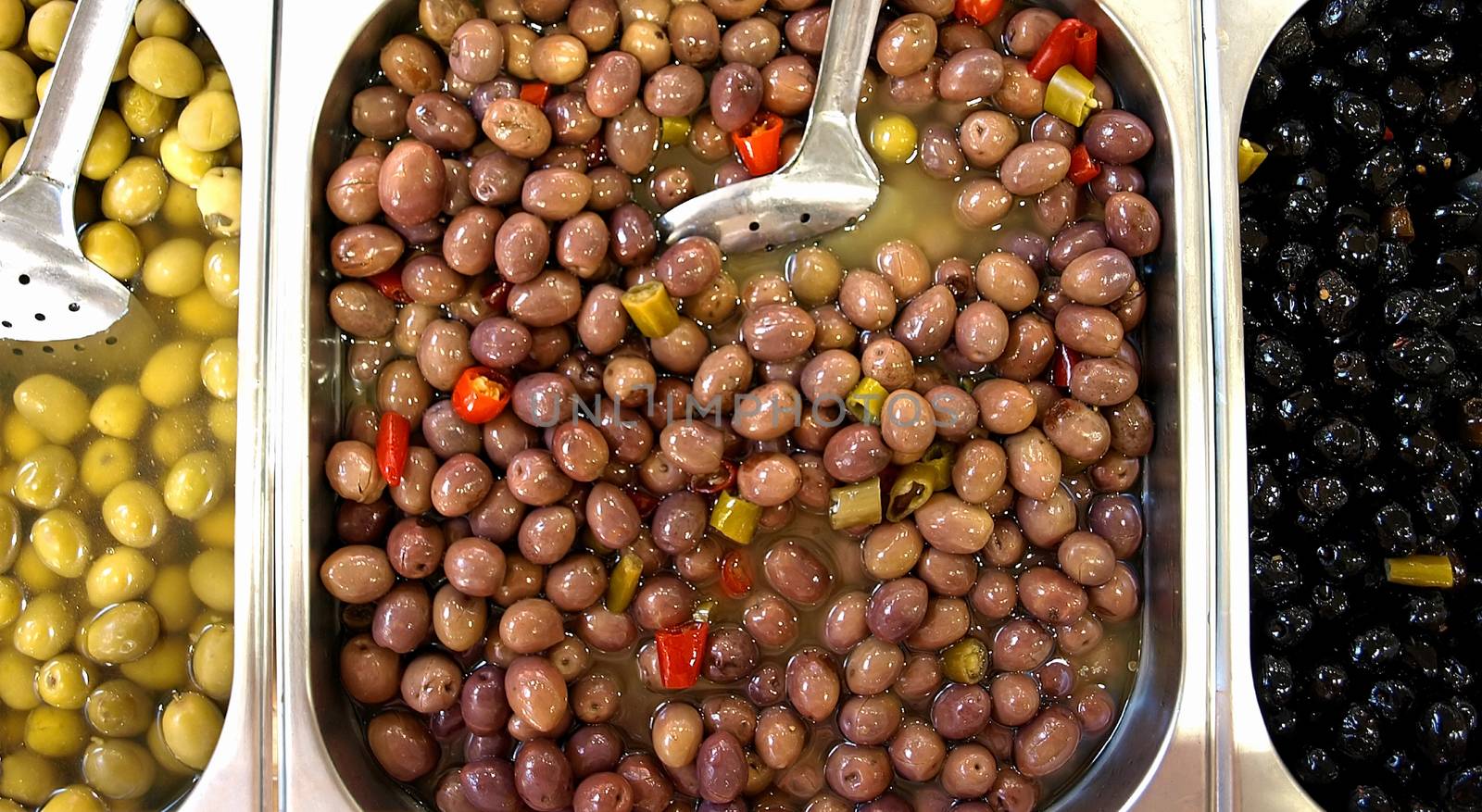 Pickled olives for sale in an open market in France.