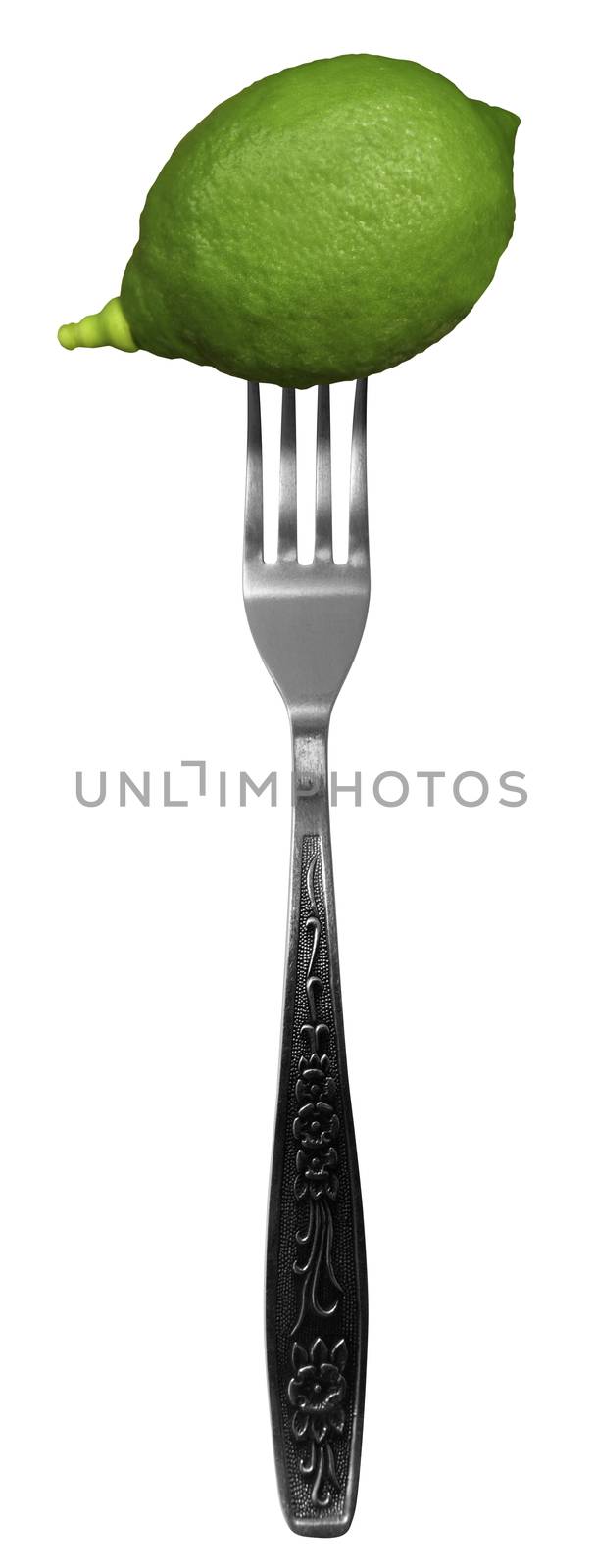 Green lime on fork isolated on a white background.
