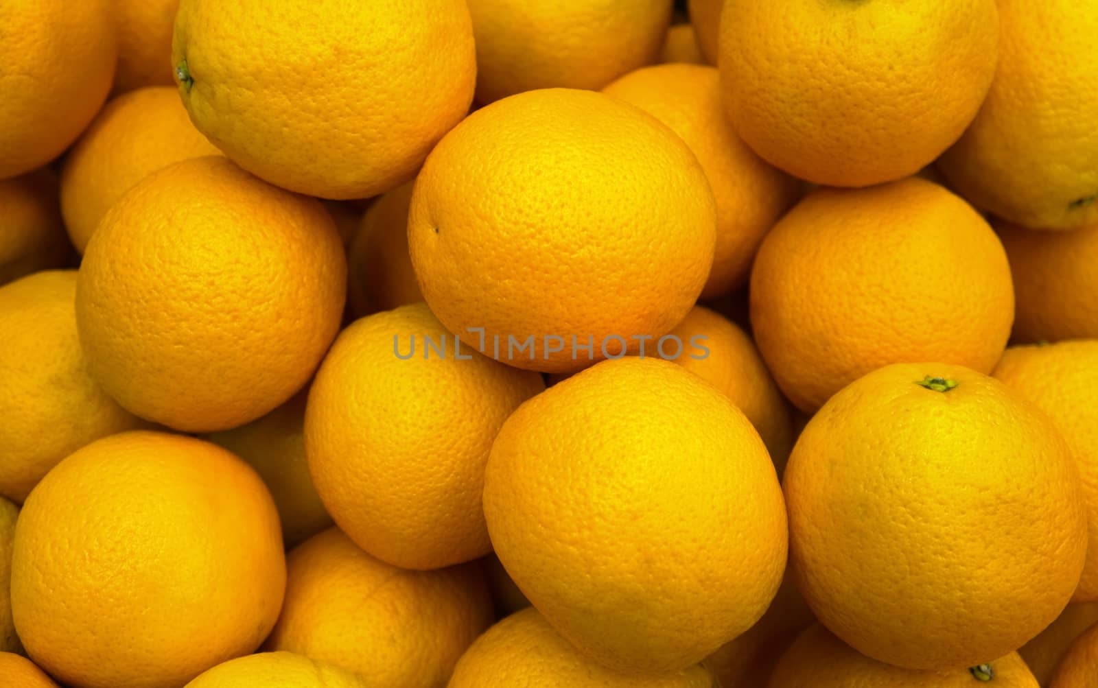 Lots of fresh oranges on market place