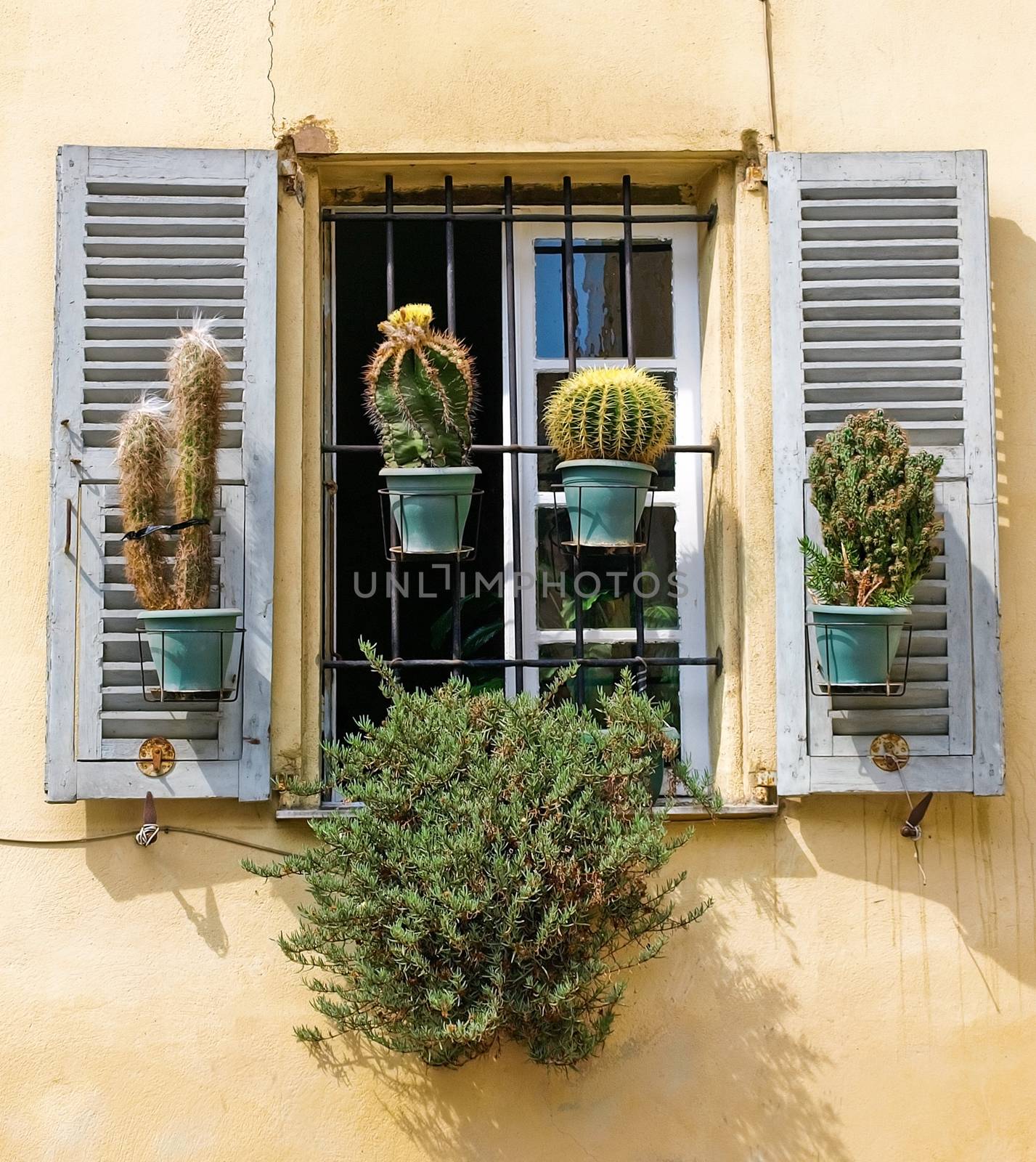 Traditional French window with shutters in Nice, France