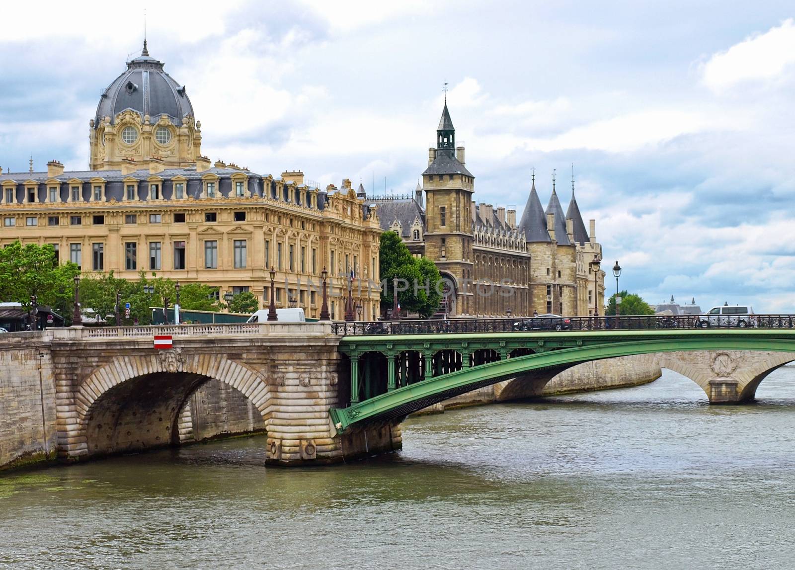 View of Palais de Justice and a bridge over the Seine river. Paris, France.