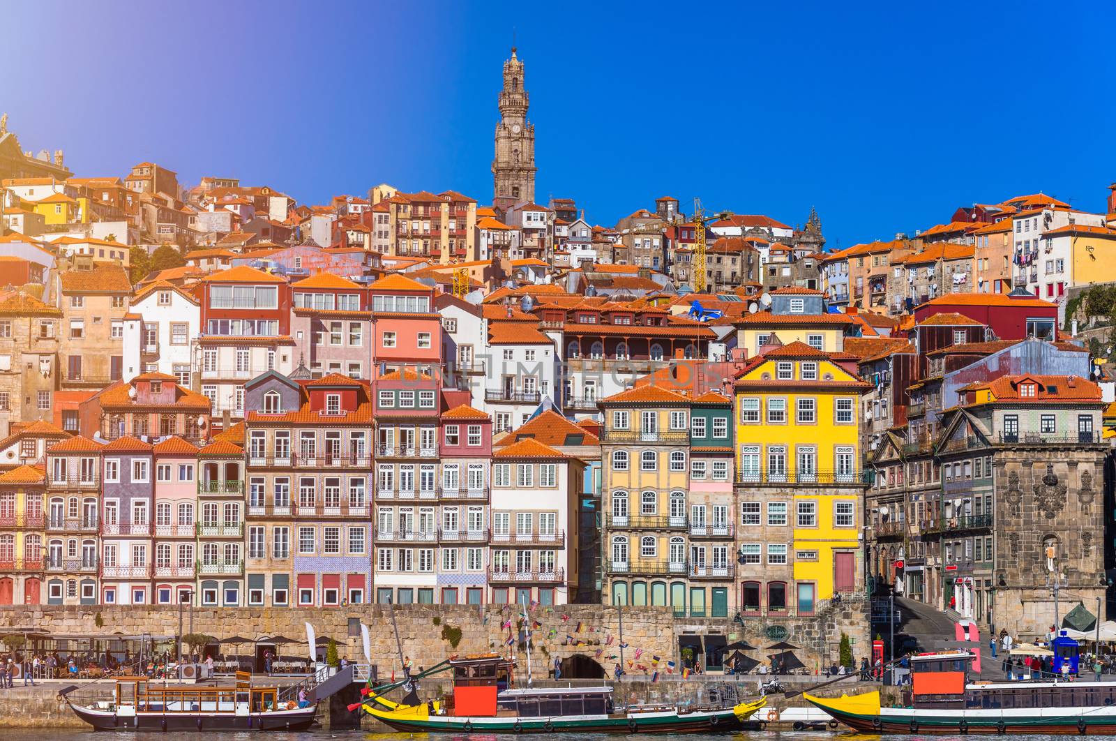 Ancient city of Porto with old multi-colored houses with red roof tiles. Portugal, Porto