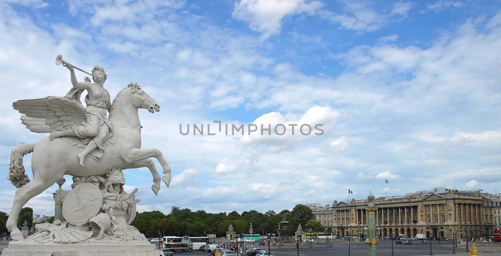 Winged statue at the entrance to the Jardins des Tuileries on the Place de la Concorde.
