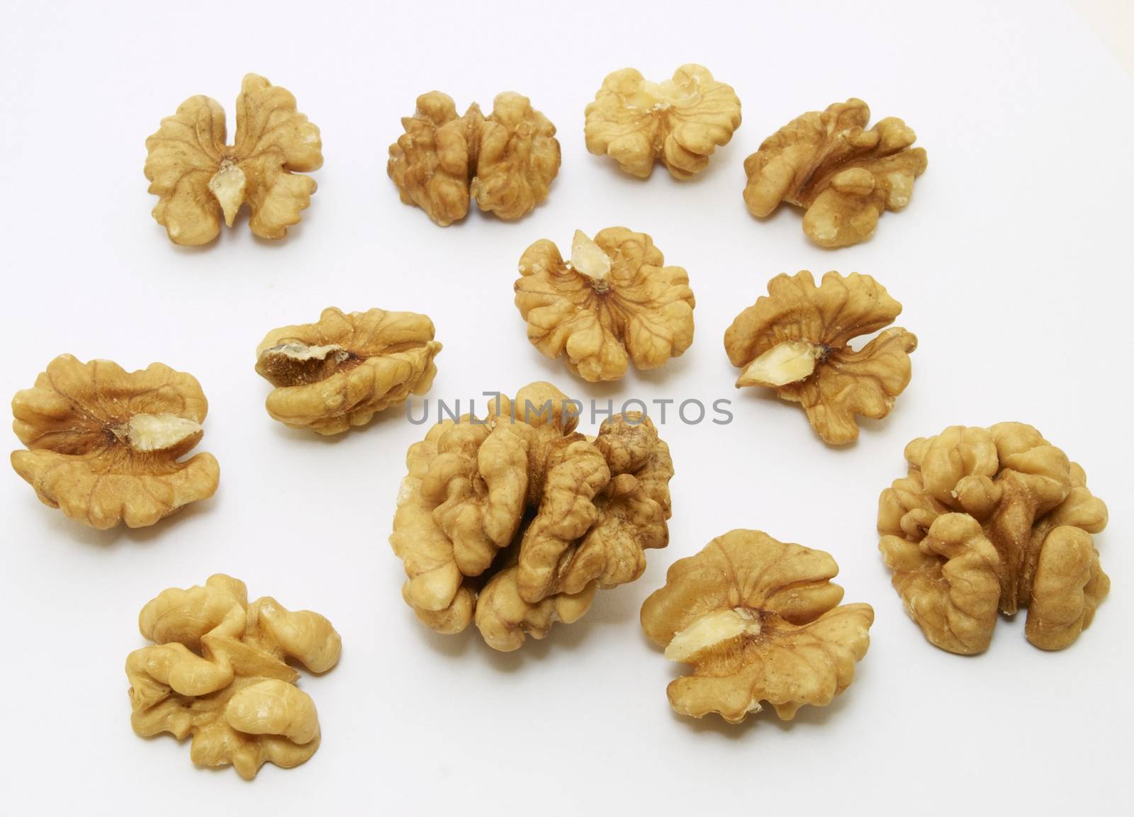 Kernels of walnuts on white background.