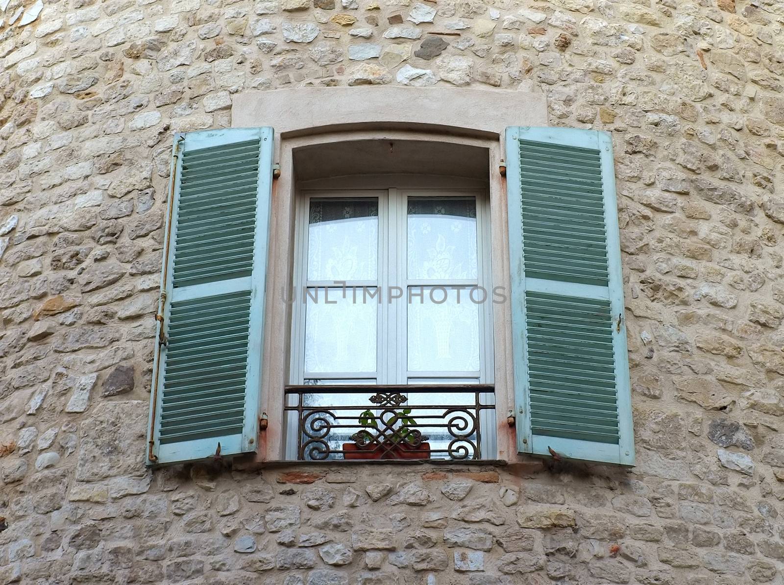 Window on medieval stone wall - Antibes, France