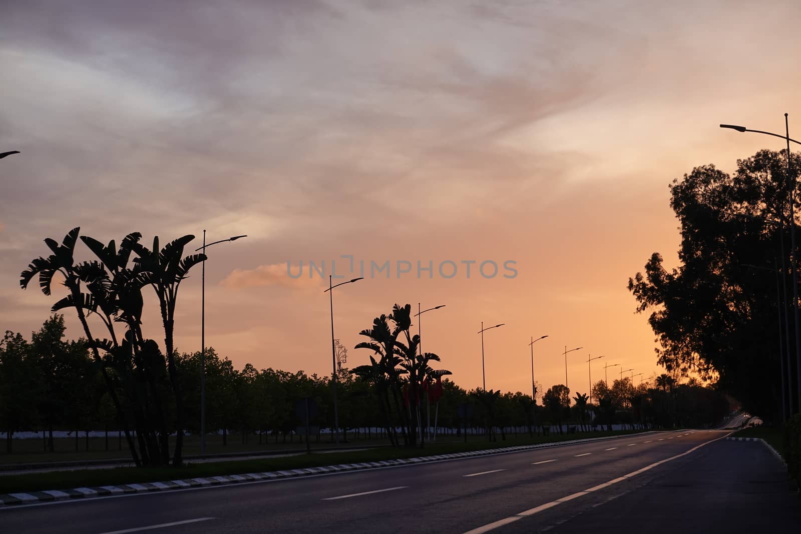 a lonly empty road by the time of sunset by devoxer