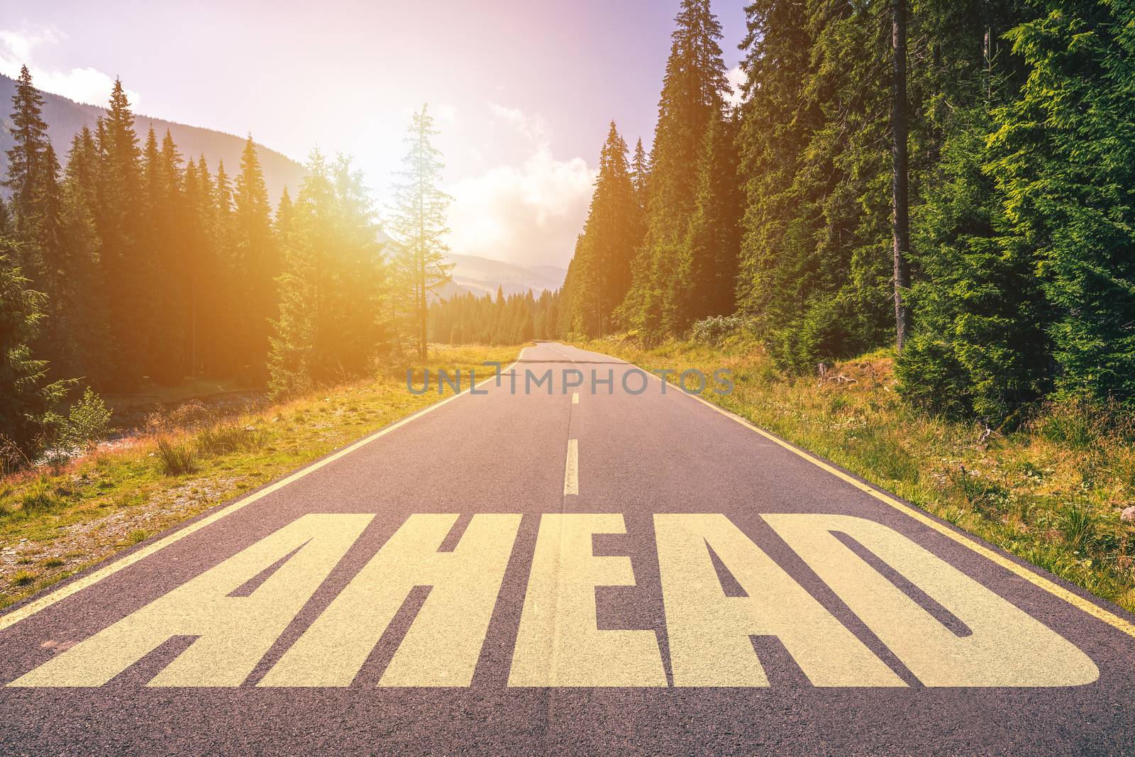 Ahead word written on road in the mountains