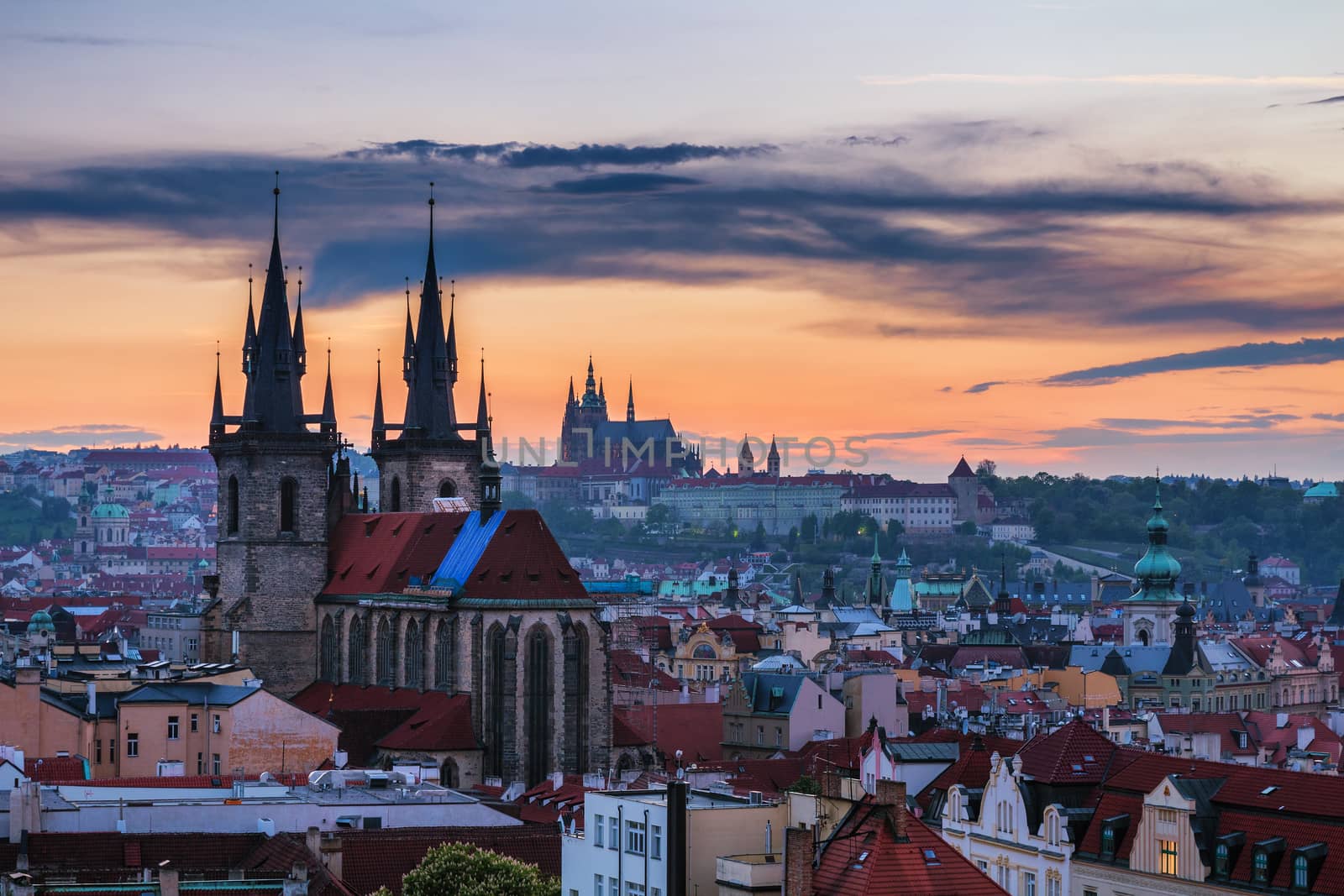Panorama of Prague with red roofs from above summer day at dusk, Czech Republic