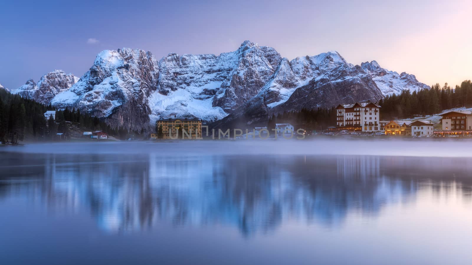 Misurina Lake, on Dolomites (Italian Alps) seen at sunrise. Sorapiss mountain in the background. South Tyrol, Dolomites, Italy.