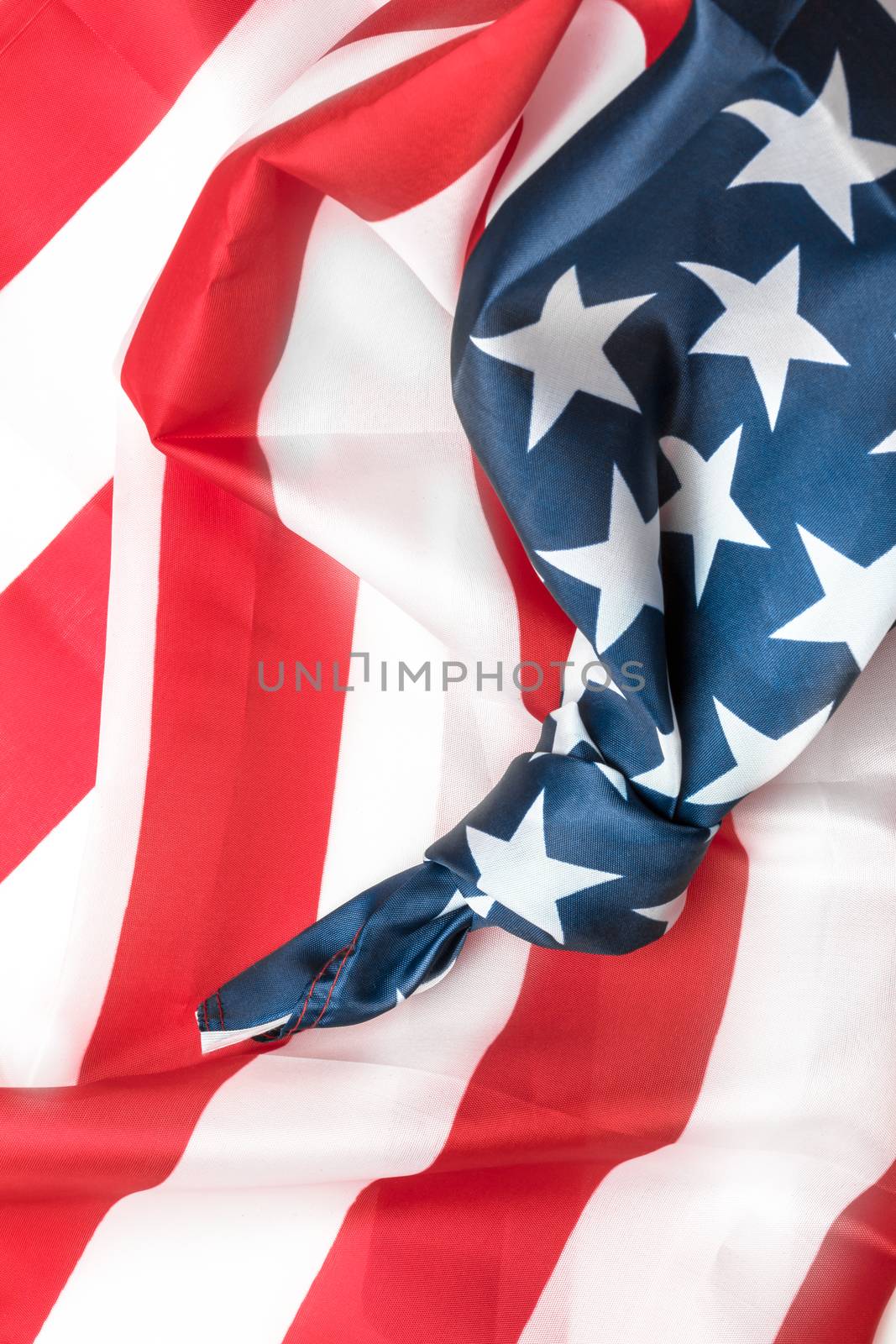Closeup of American flag with knot. Conceptual representation of an important event to remember. Save the date.