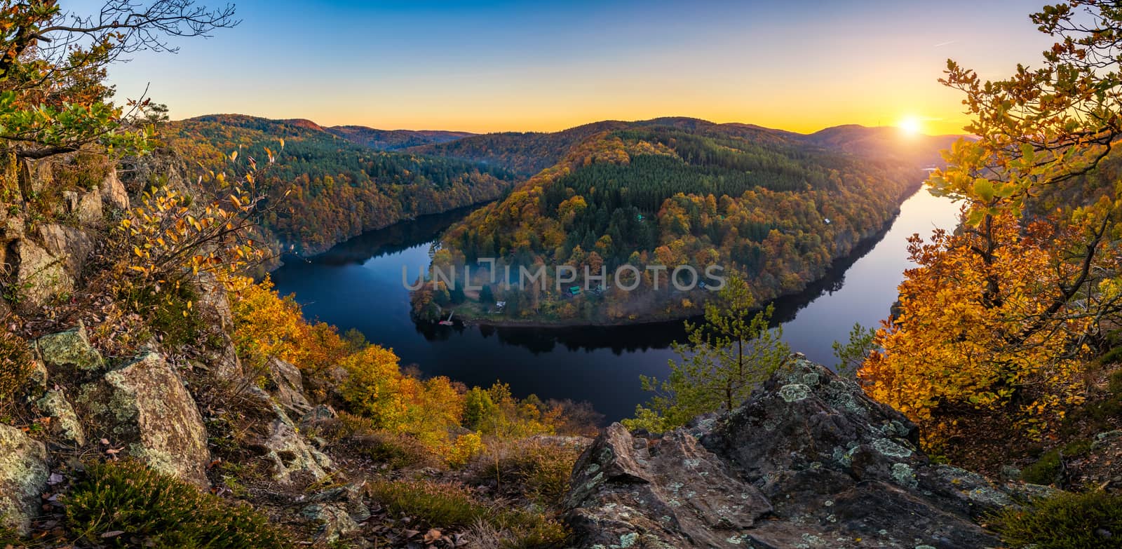River canyon with dark water and autumn colorful forest. Horseshoe bend, Vltava river, Czech republic. Beautiful landscape with river