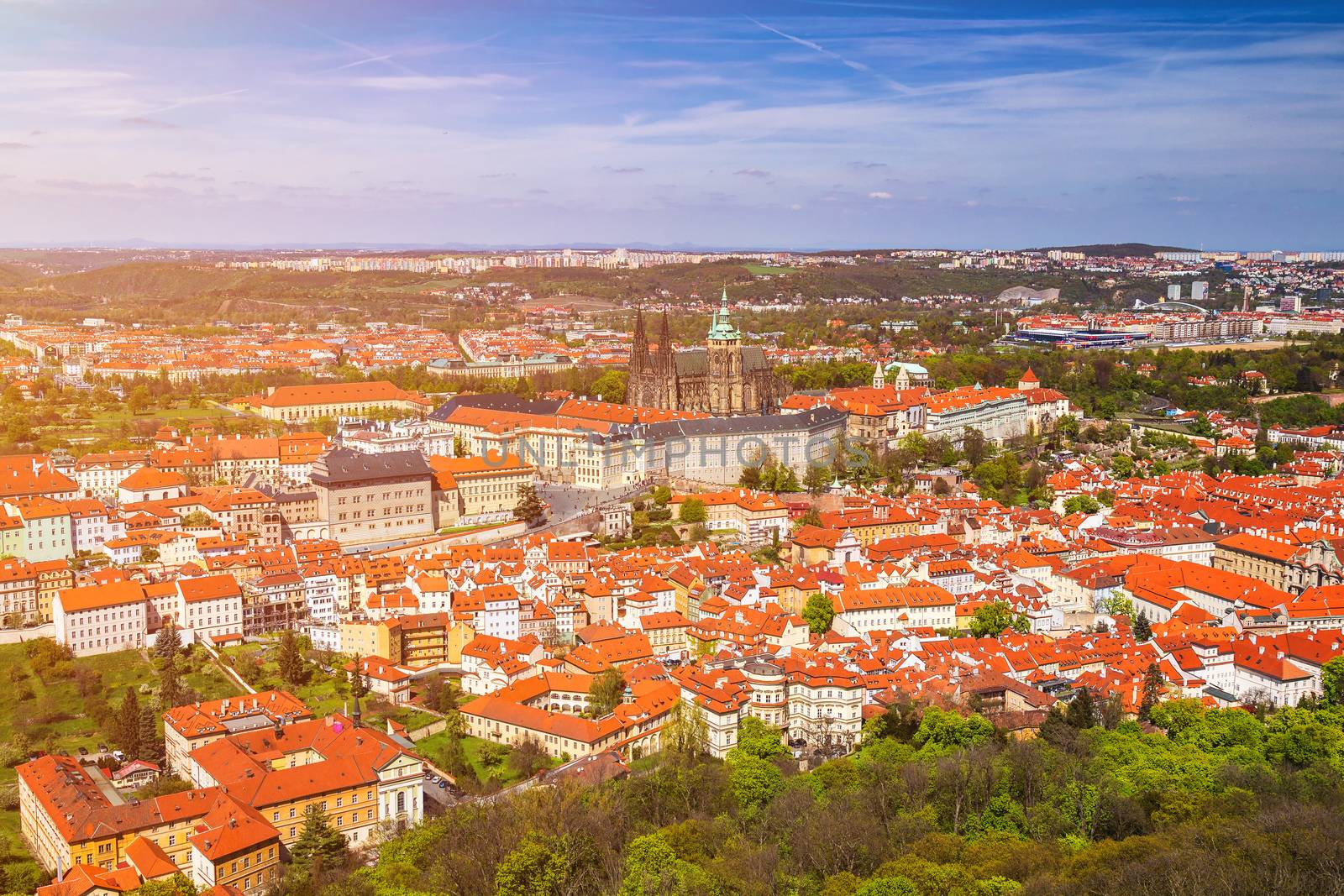 erial view of old Red Tiles roofs in the city Prague, Czech Republic, Europe. Beautiful day with blue sky with clouds in the town.