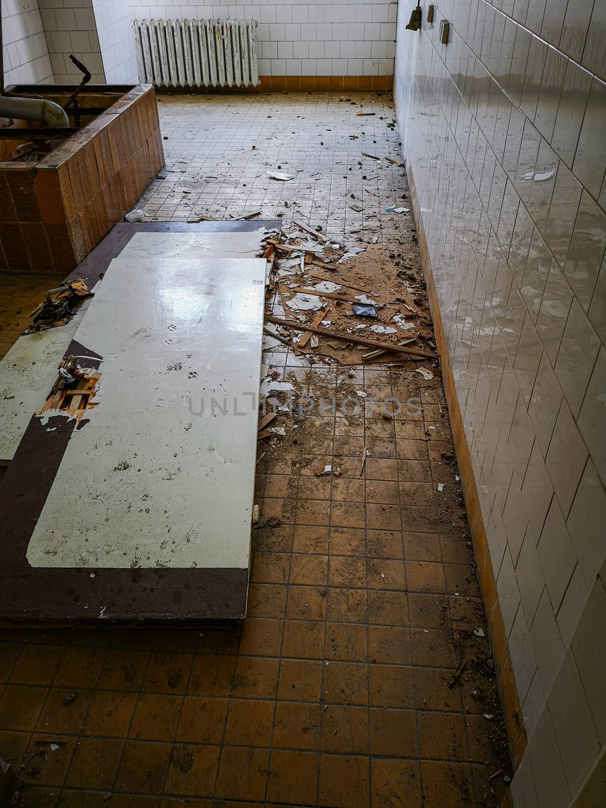 Old wooden hospital doors lying on the ground in old abandoned hospital by Wierzchu