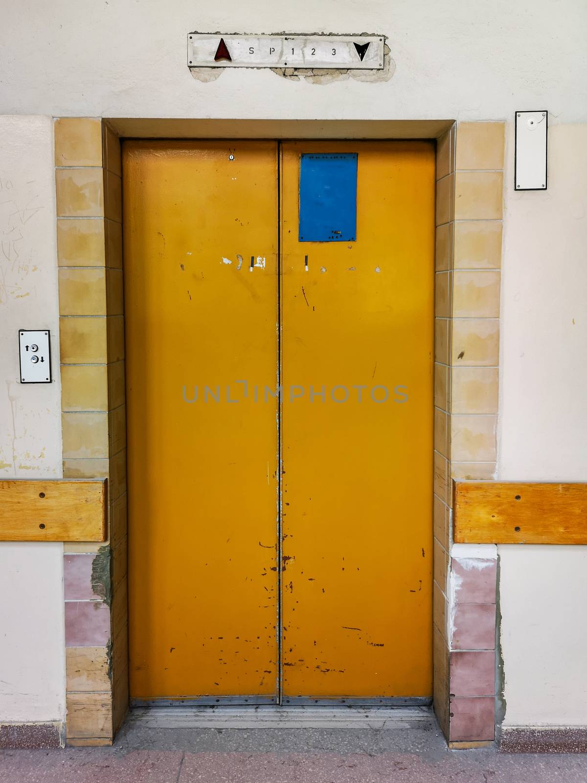 Entrance doors to old metal elevator in old abandoned hospital