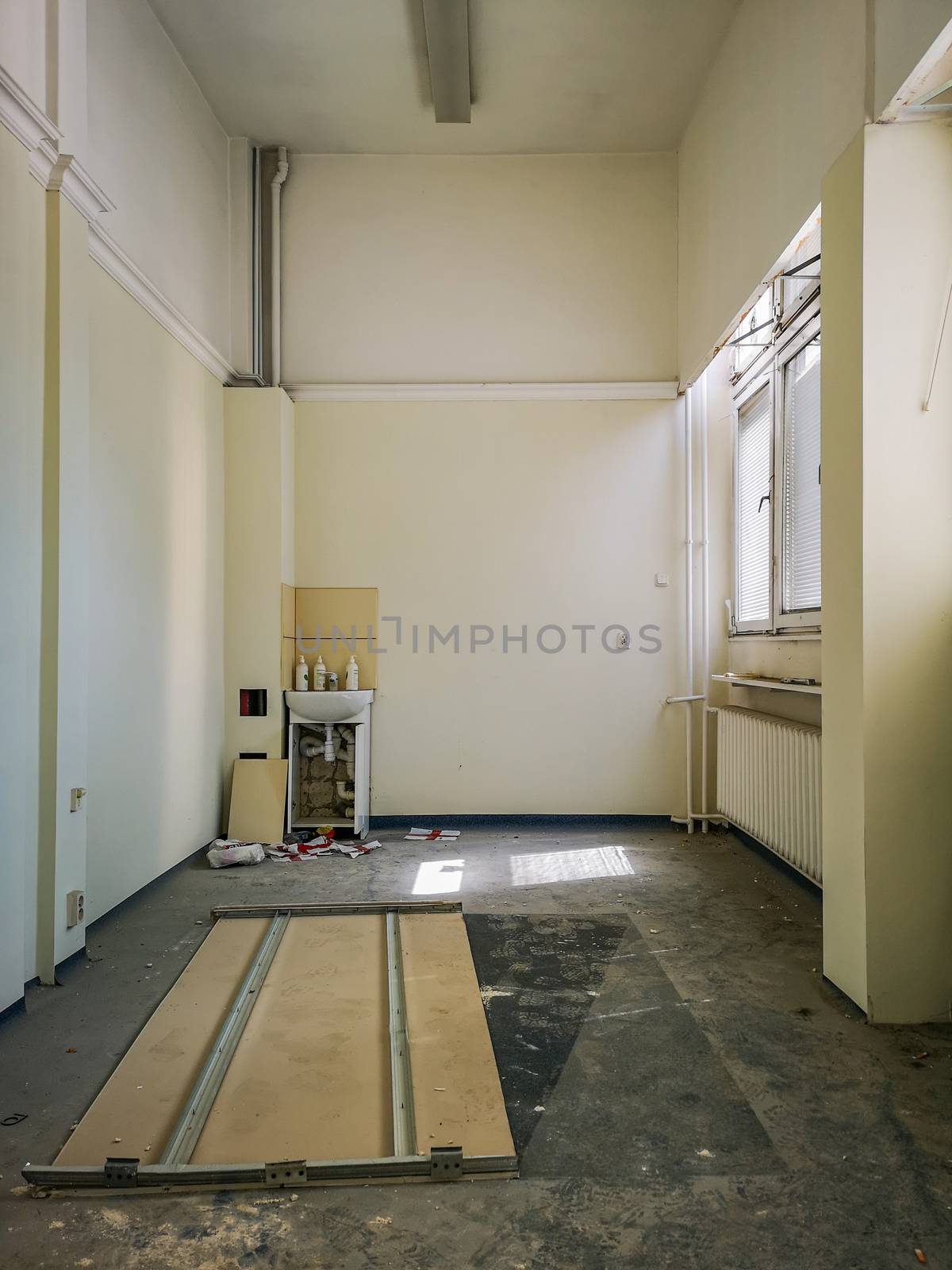 Empty ruined hospital room with sun lights in old abandoned hospital