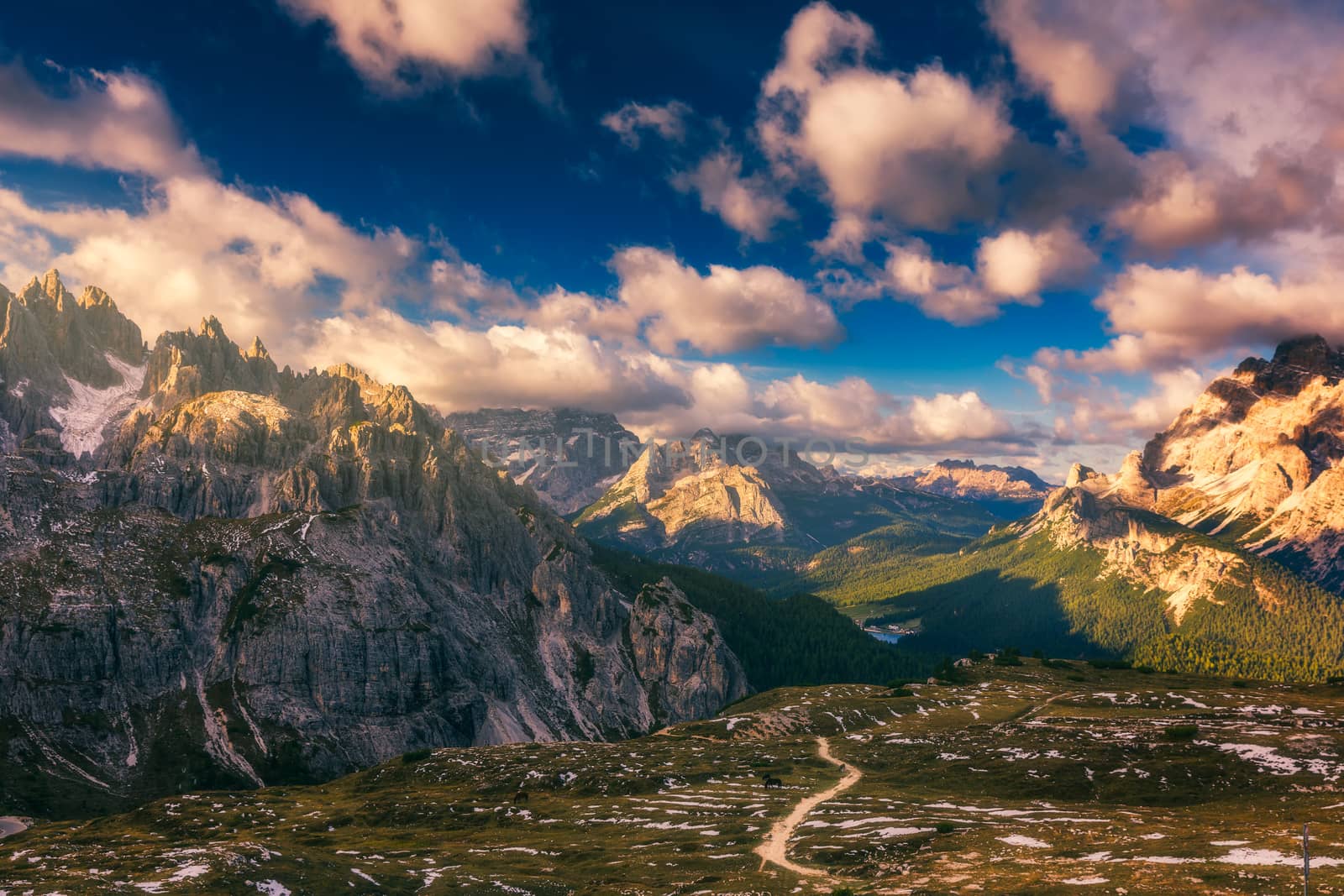 Hiking Trail in Tre Cime di Laveredo. Lake. Meadow. Green Grass. Summer. Blue Sky. Mountain Peak. Dolomites. Italy. Tre cime are one of the best-known mountain groups in the European Alps