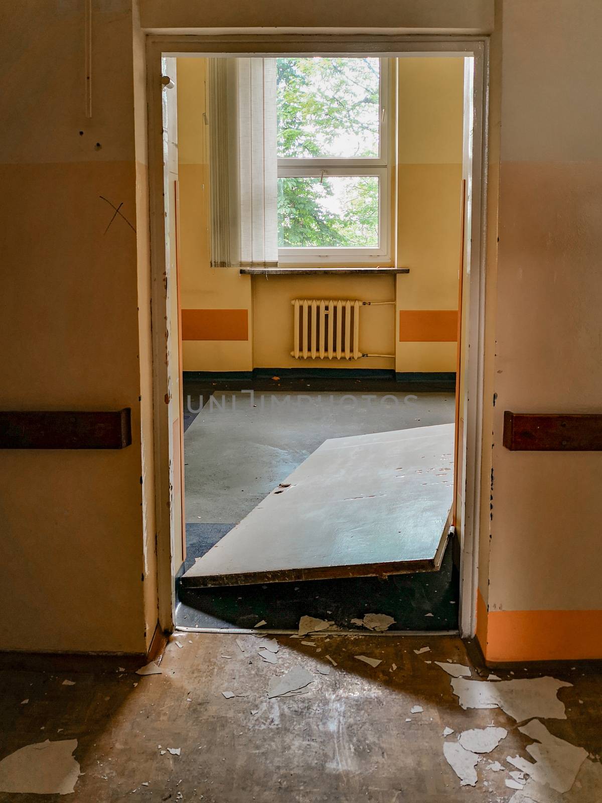 Forced doors of old abandoned hospital room