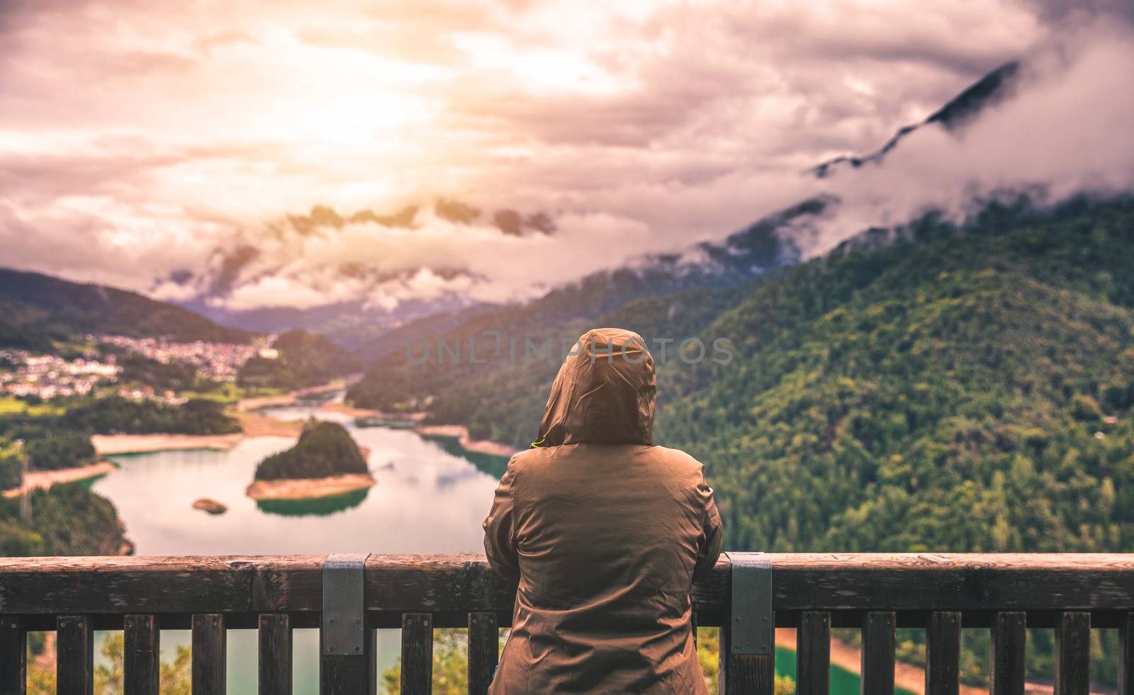 Traveler relaxing meditation with serene view mountains and lake landscape. Travel Lifestyle hiking concept summer vacations outdoor.