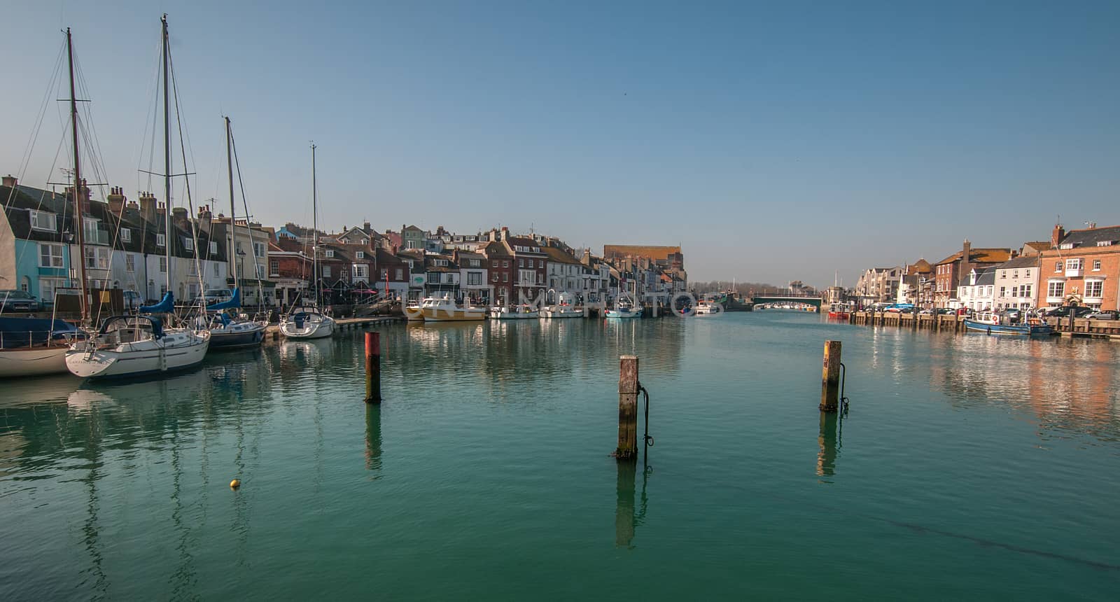 tranquil weymouth harbour in the summer by sirspread