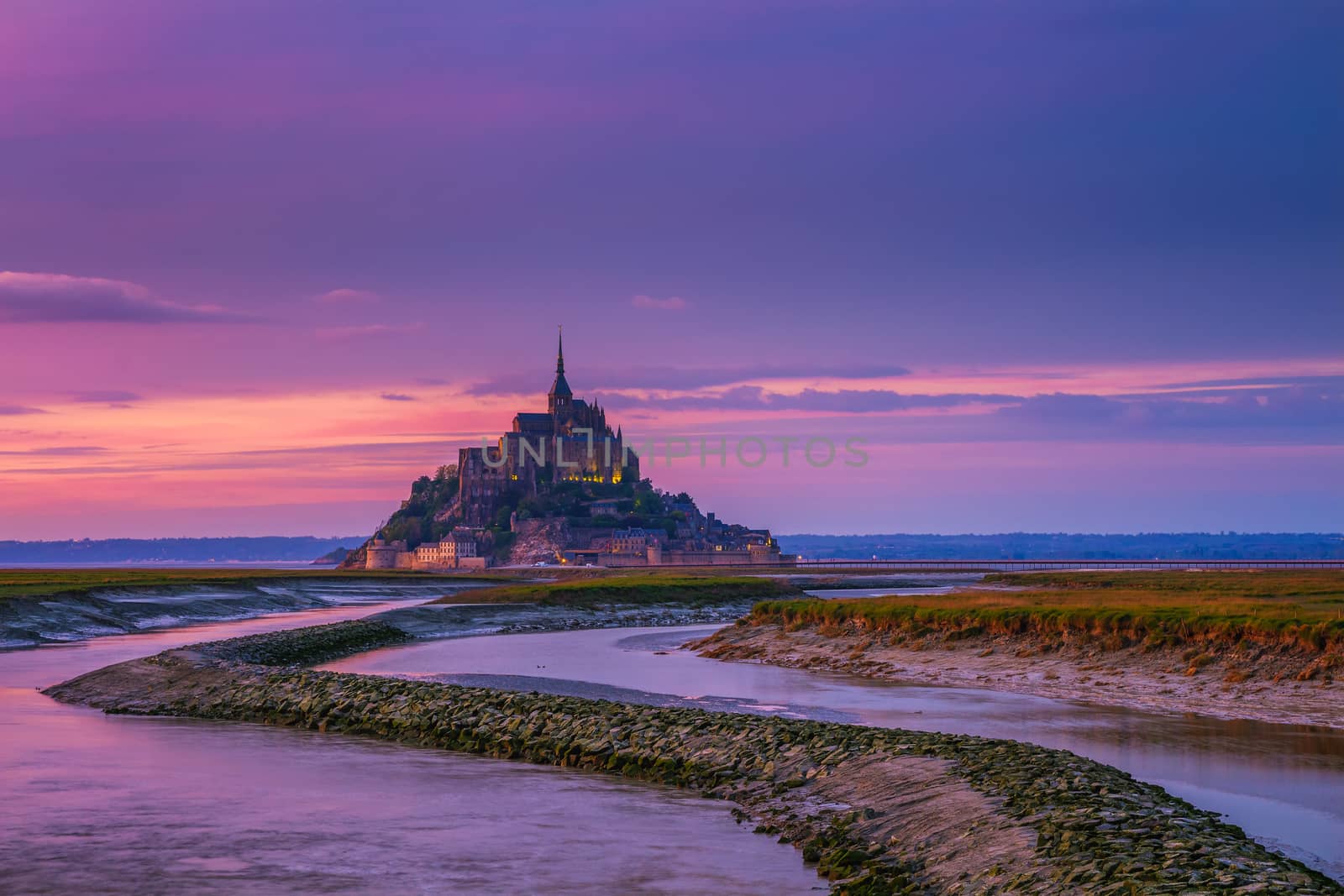 Panoramic view of famous Le Mont Saint-Michel tidal island at sunset, Normandy, northern France